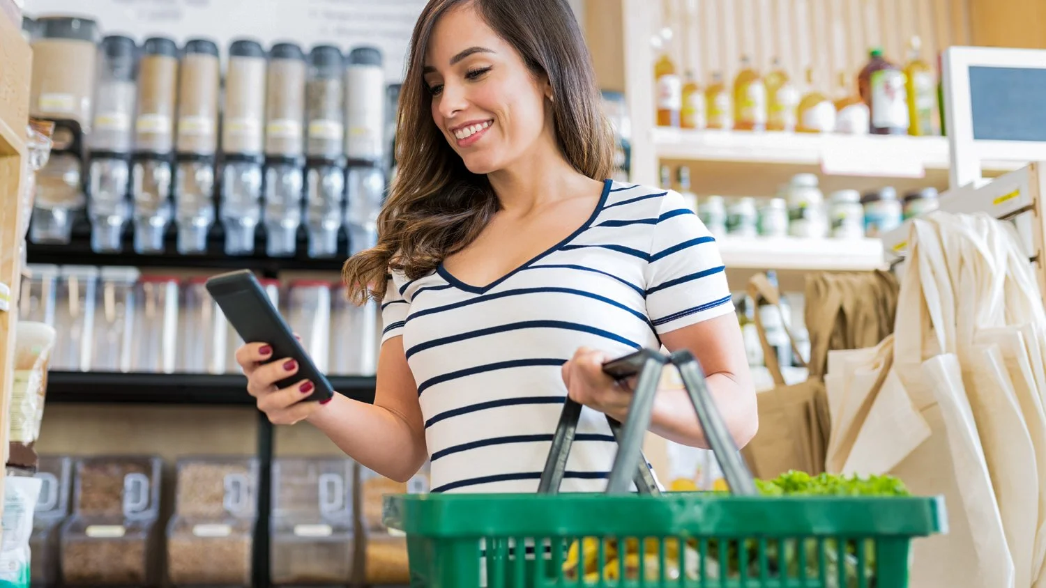 Woman shopping for food in this concept image for a small retail grocery opportunity in Elkhart, IN.