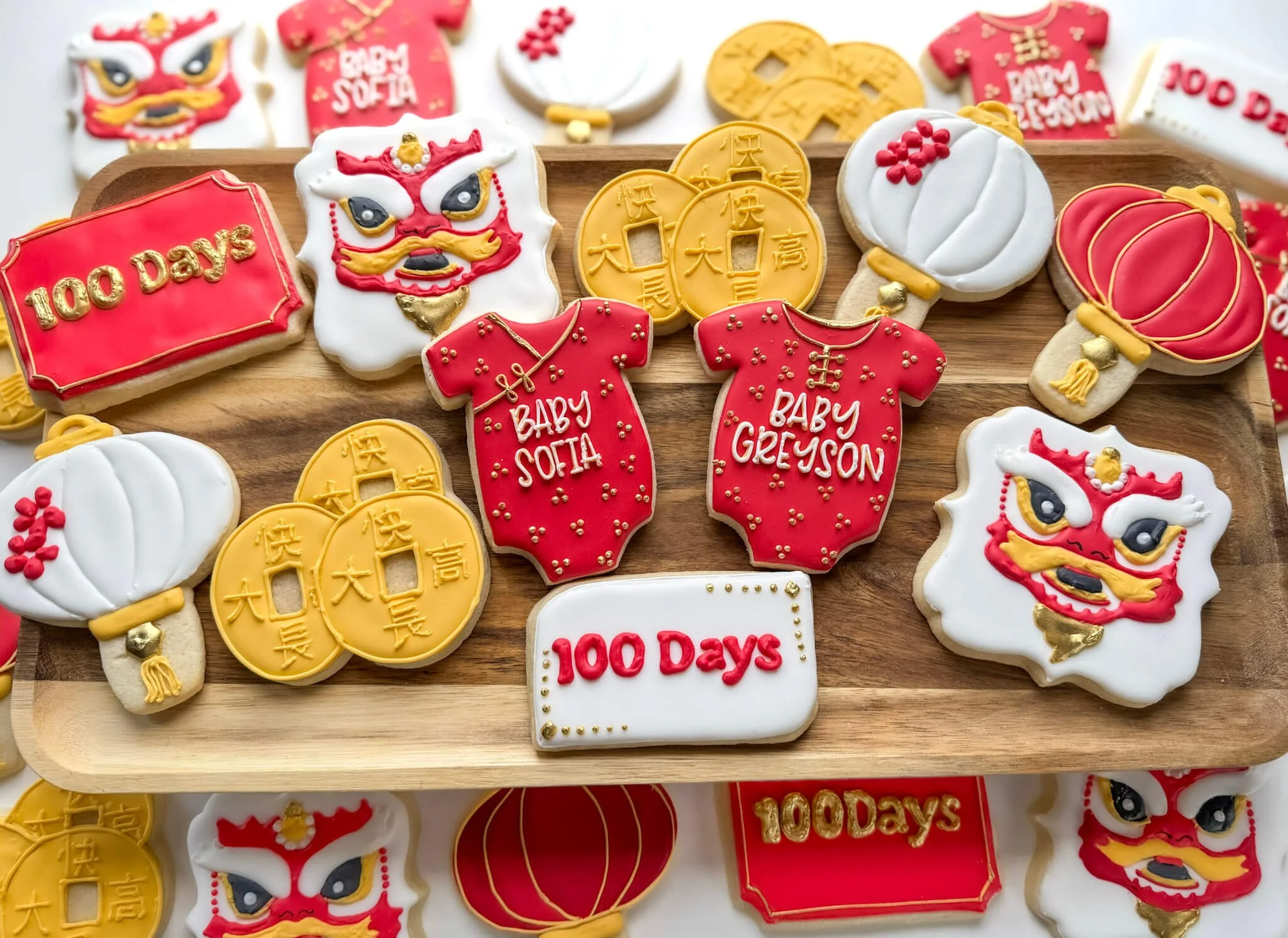Stunning display of custom baby shower cookies decorated to celebrate the Chinese 100 Days Celebration. Choose your own unique theme for your order with Iced, RVA's custom cookies in Mechanicsville, VA.
