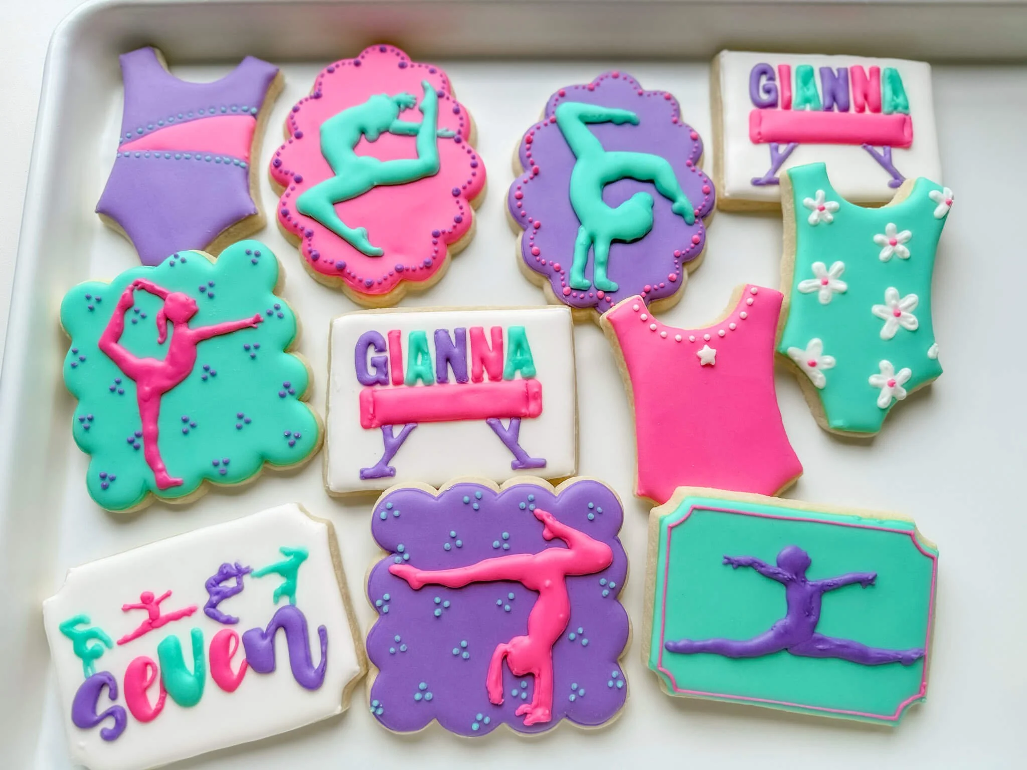 These delicious gymnast themed birthday cookies are sure to wow your kid's birthday guests. Brightly colored and decorated in the theme of your choosing, locally made in Mechanicsville, VA.