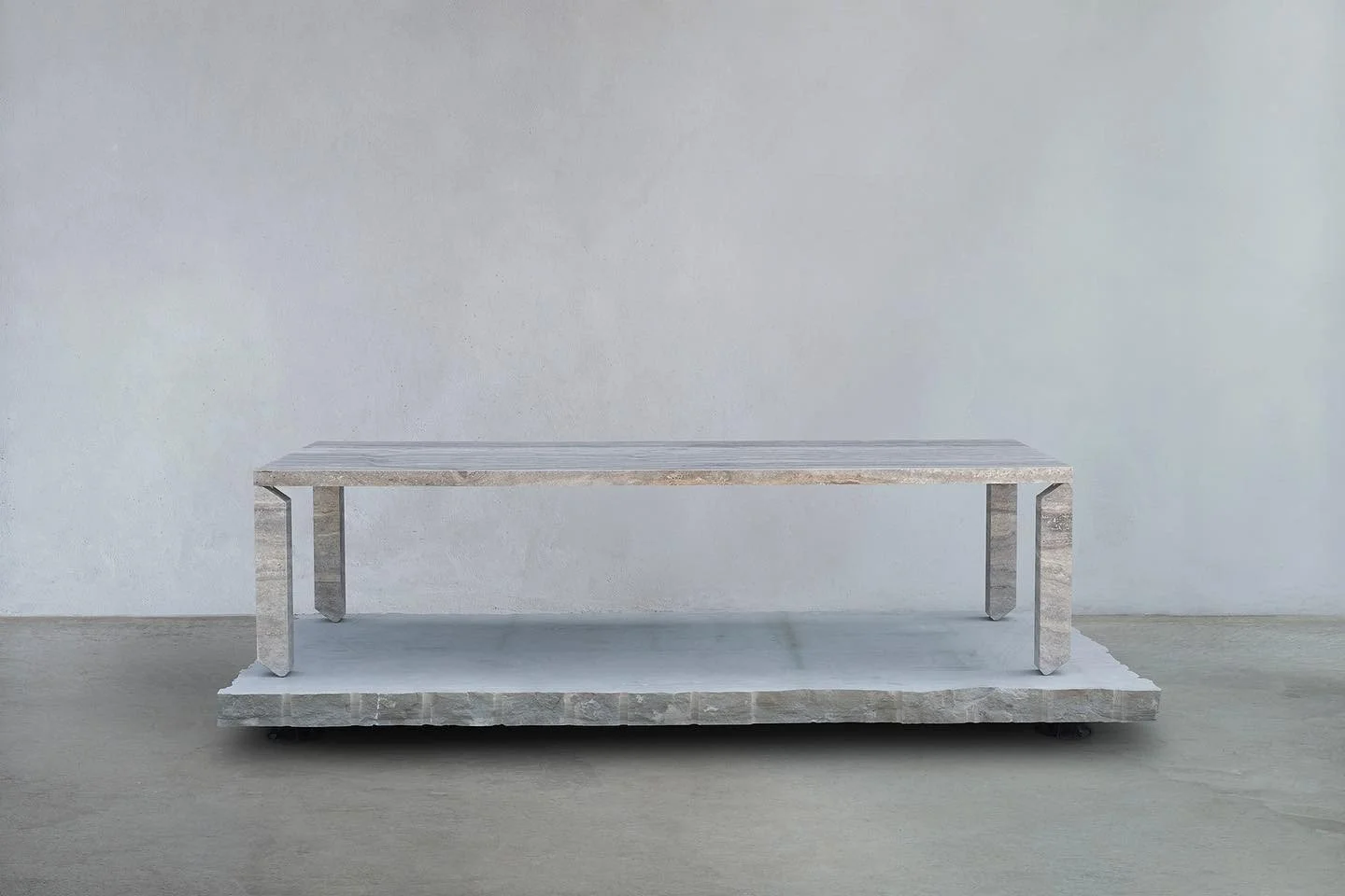 TIPTOE dining table in silver travertine.