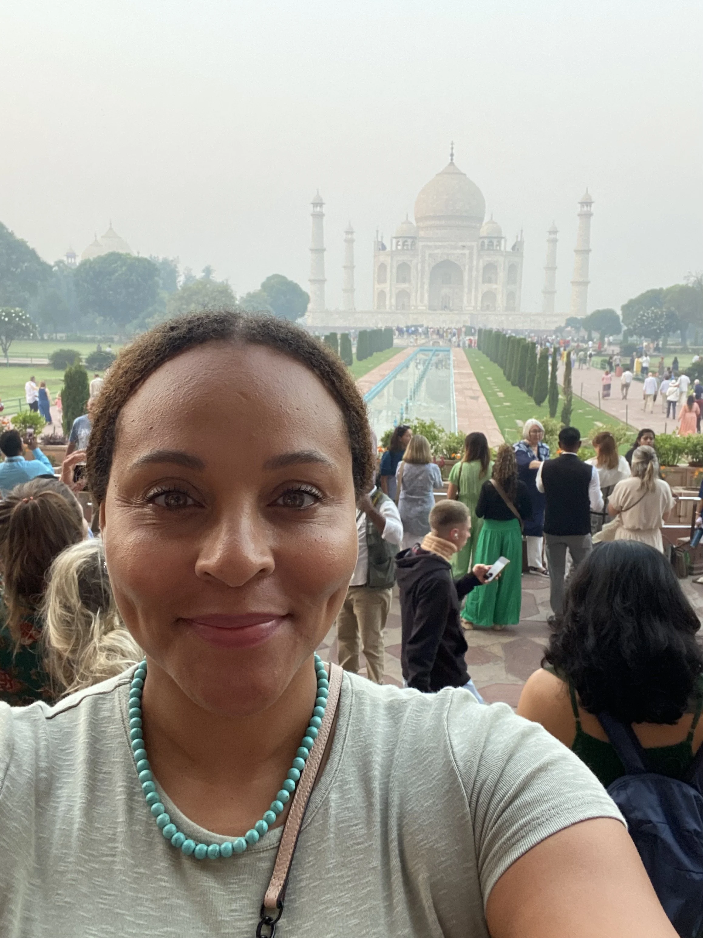 A selfie at the Taj Mahal during a yoga trip to India — a journey of self-discovery, reflection, and deepening my connection to the practice.
