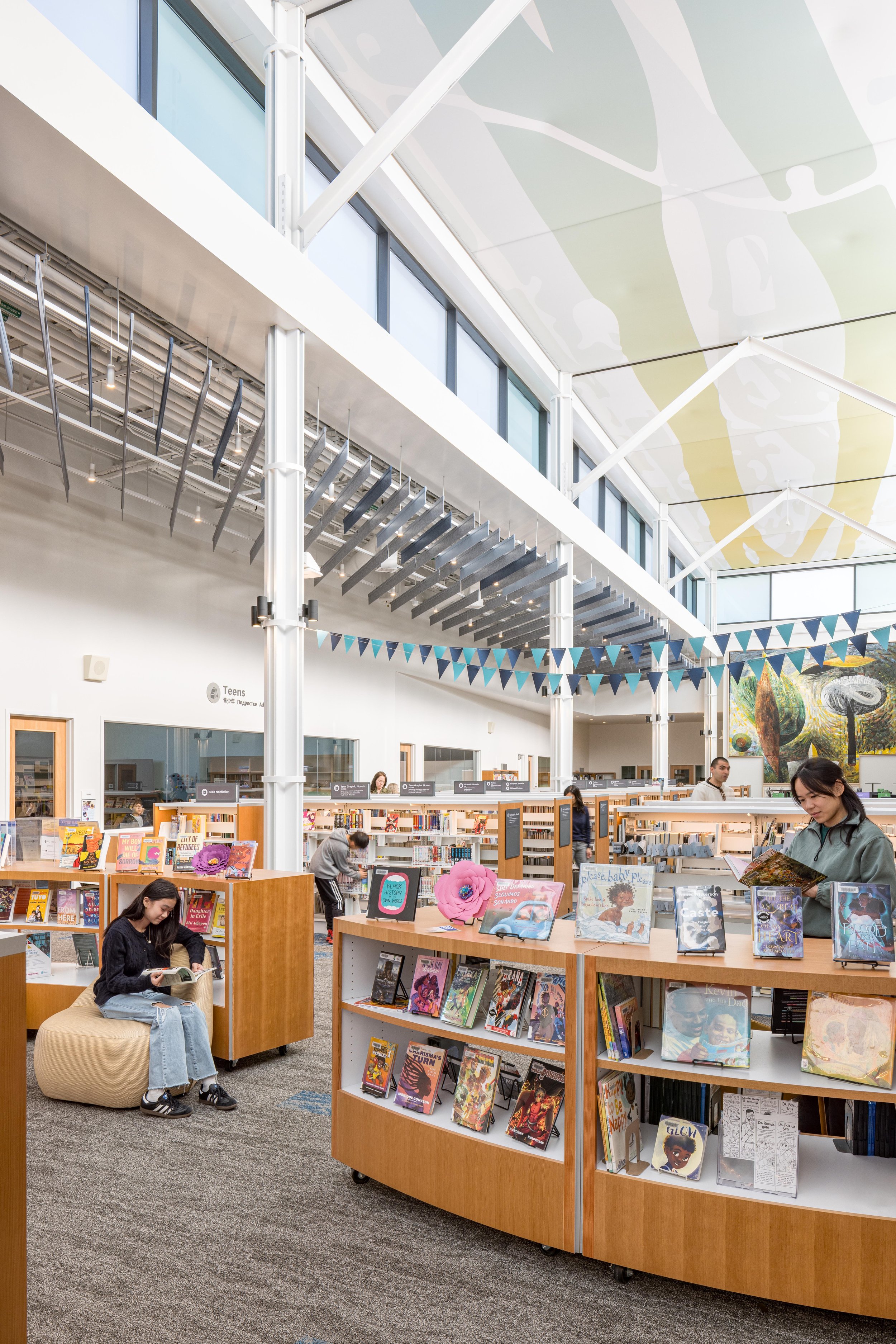 The ceiling graphic is of the Big River (known as Columbia), connecting patrons with the defining, life-giving landscape context of this library and city.