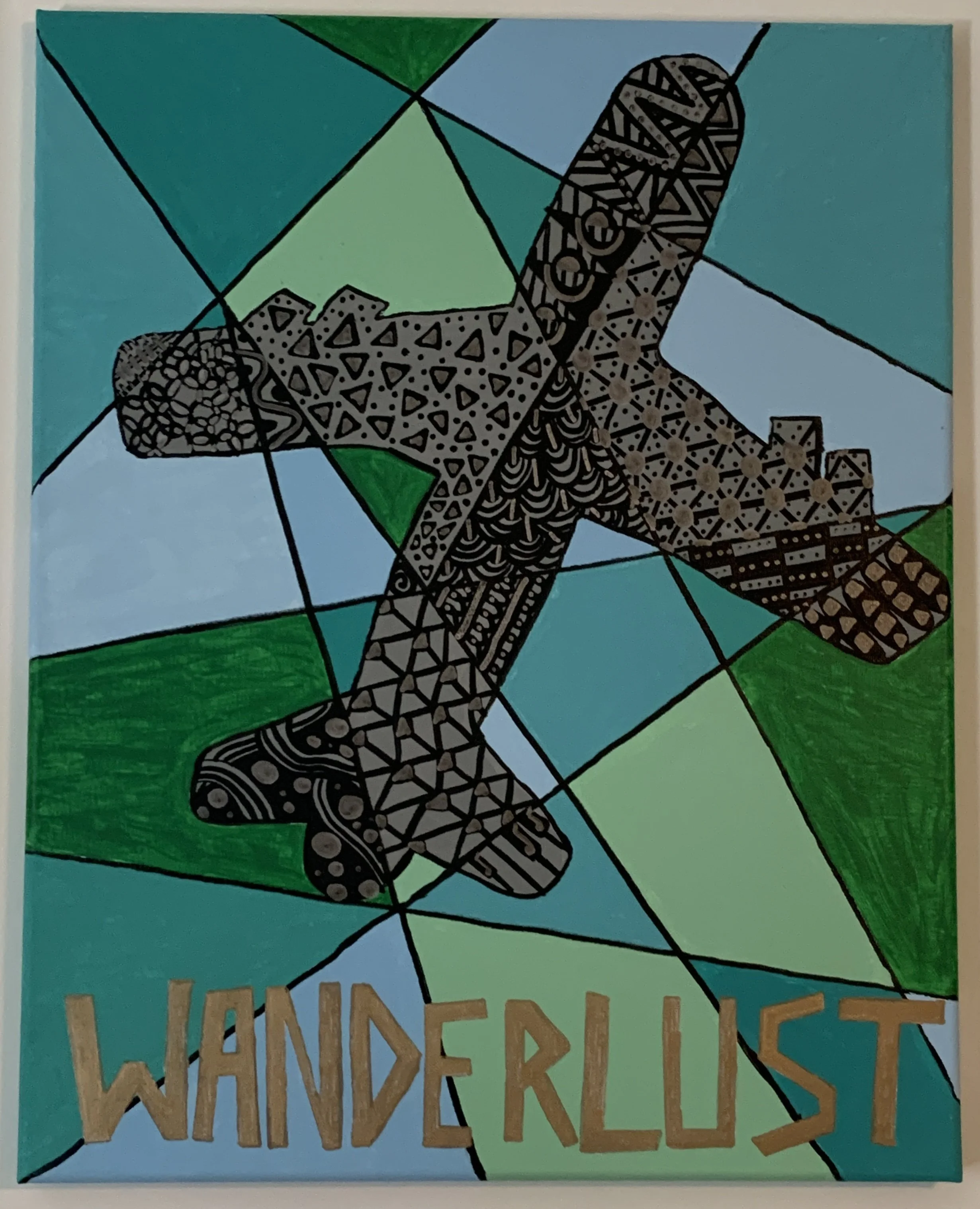 geometric airplane with "Wanderlust" in gold lettering