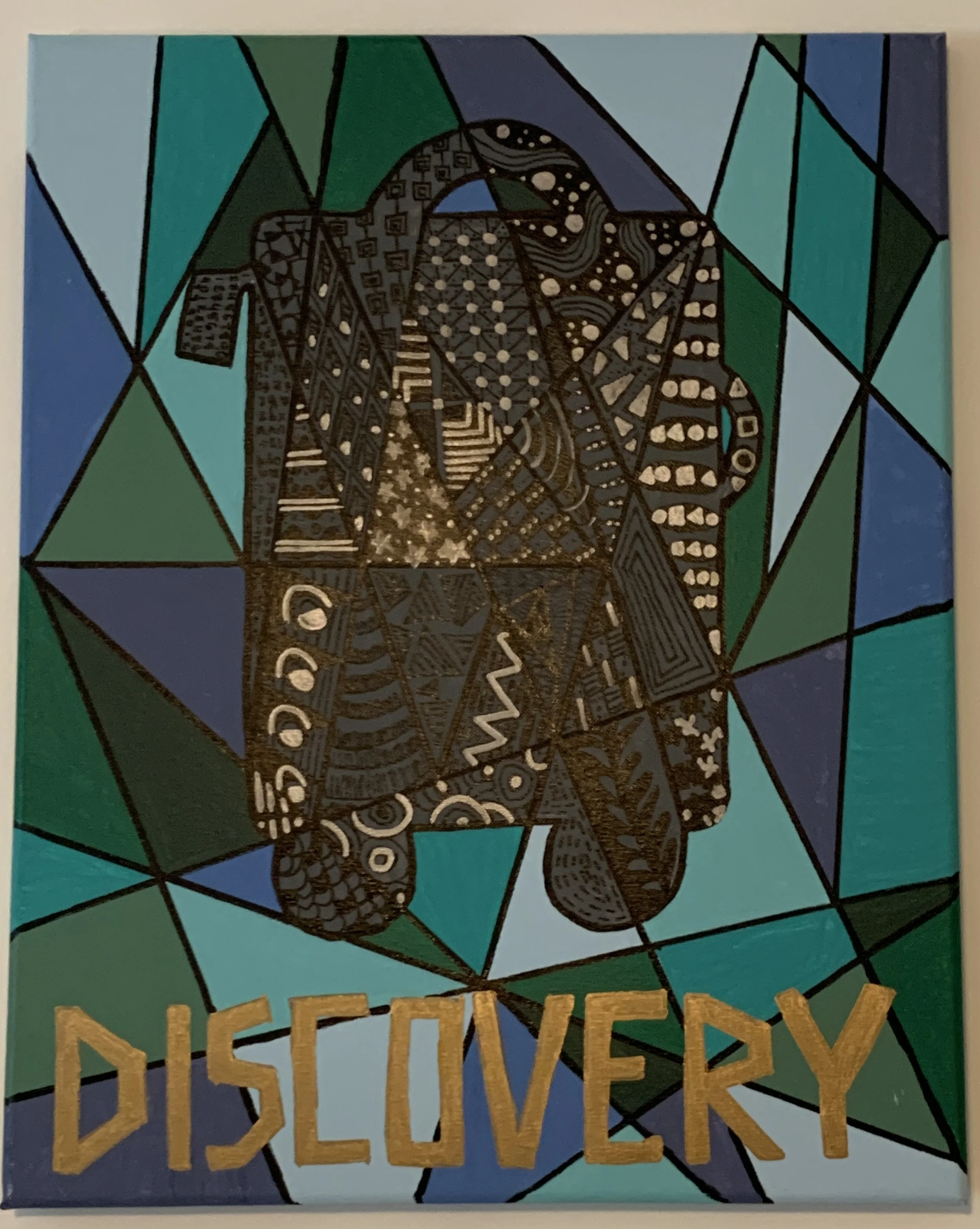 geometric suitcase with "Discovery" in gold lettering