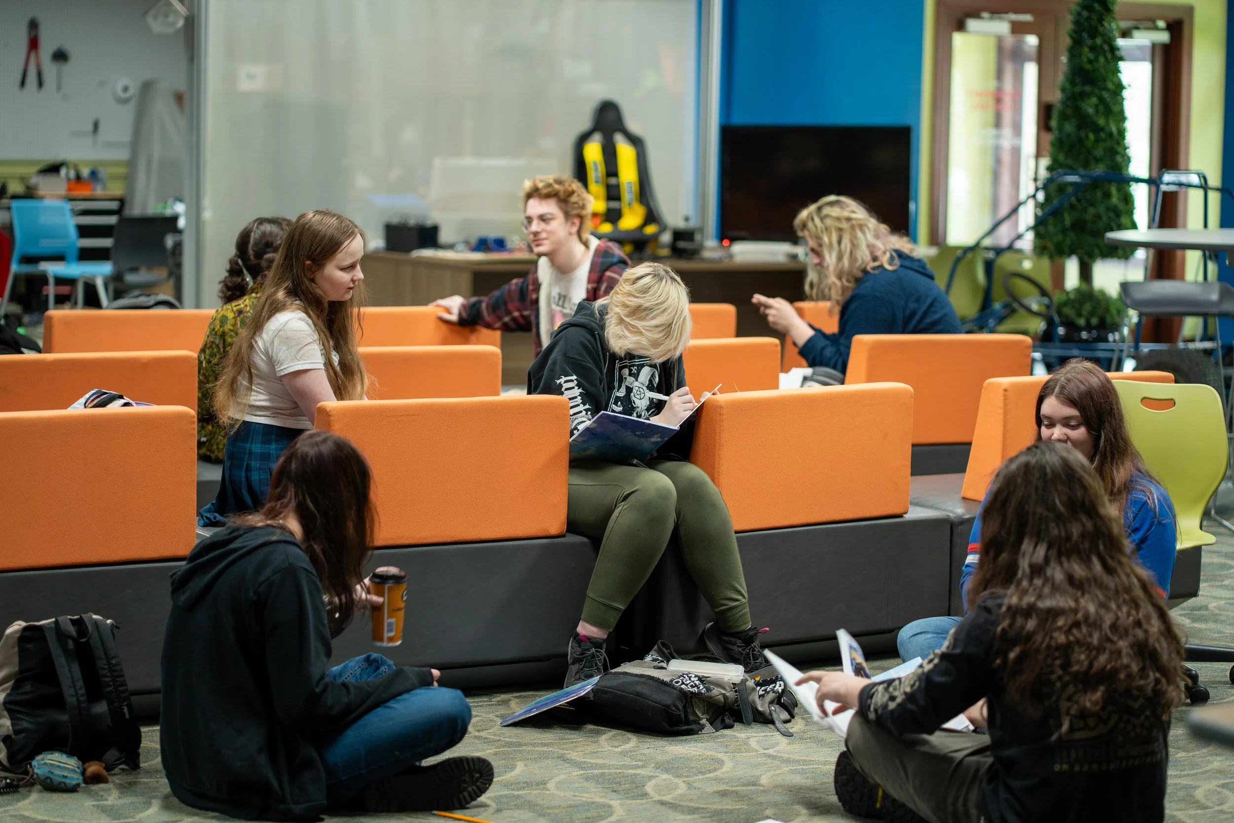 A group of FlexTech Brighton high school students doing hands-on learning activities.