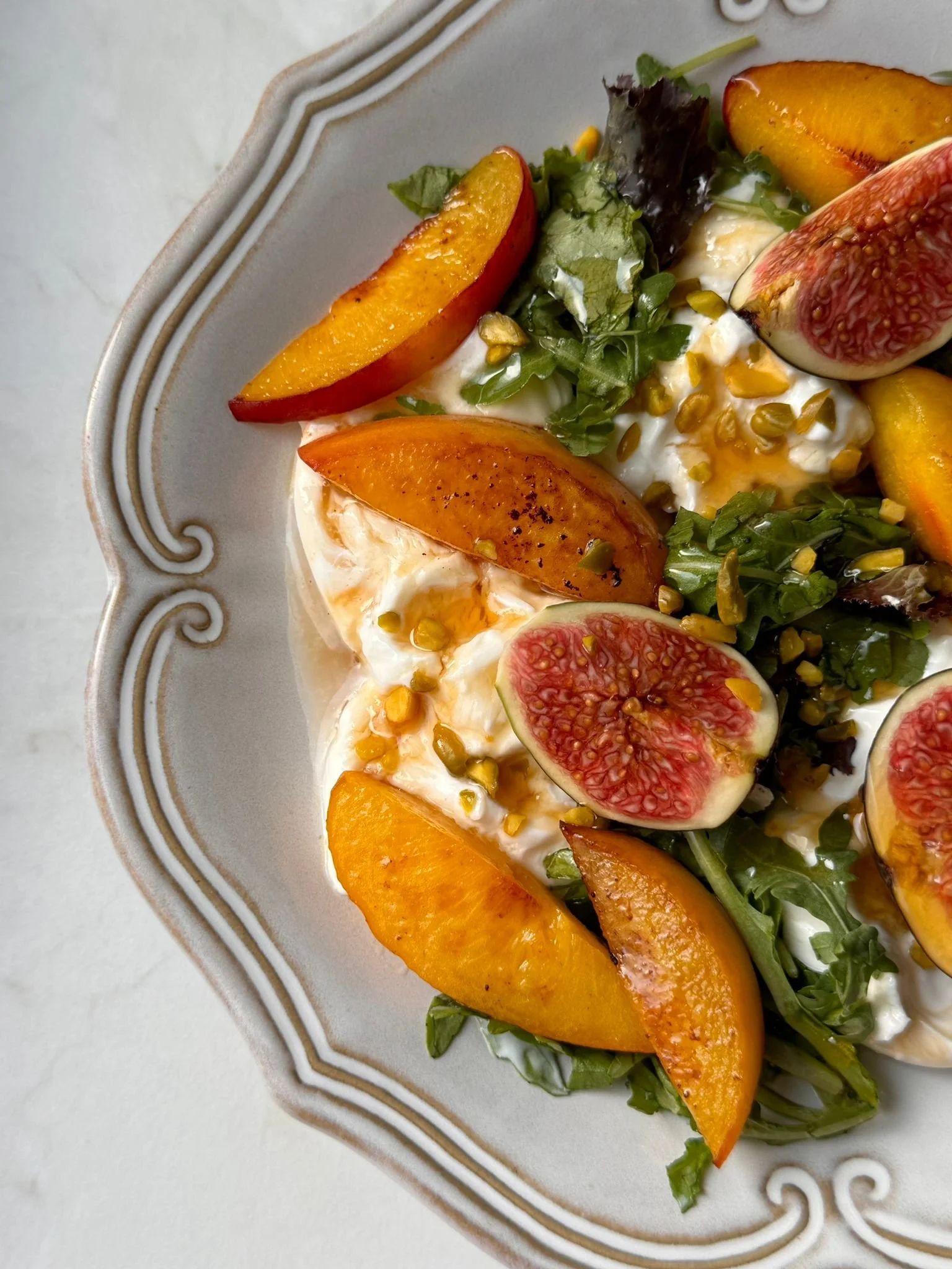 Grilled Peach and Plum Burrata Salad with Pistachios and Honey