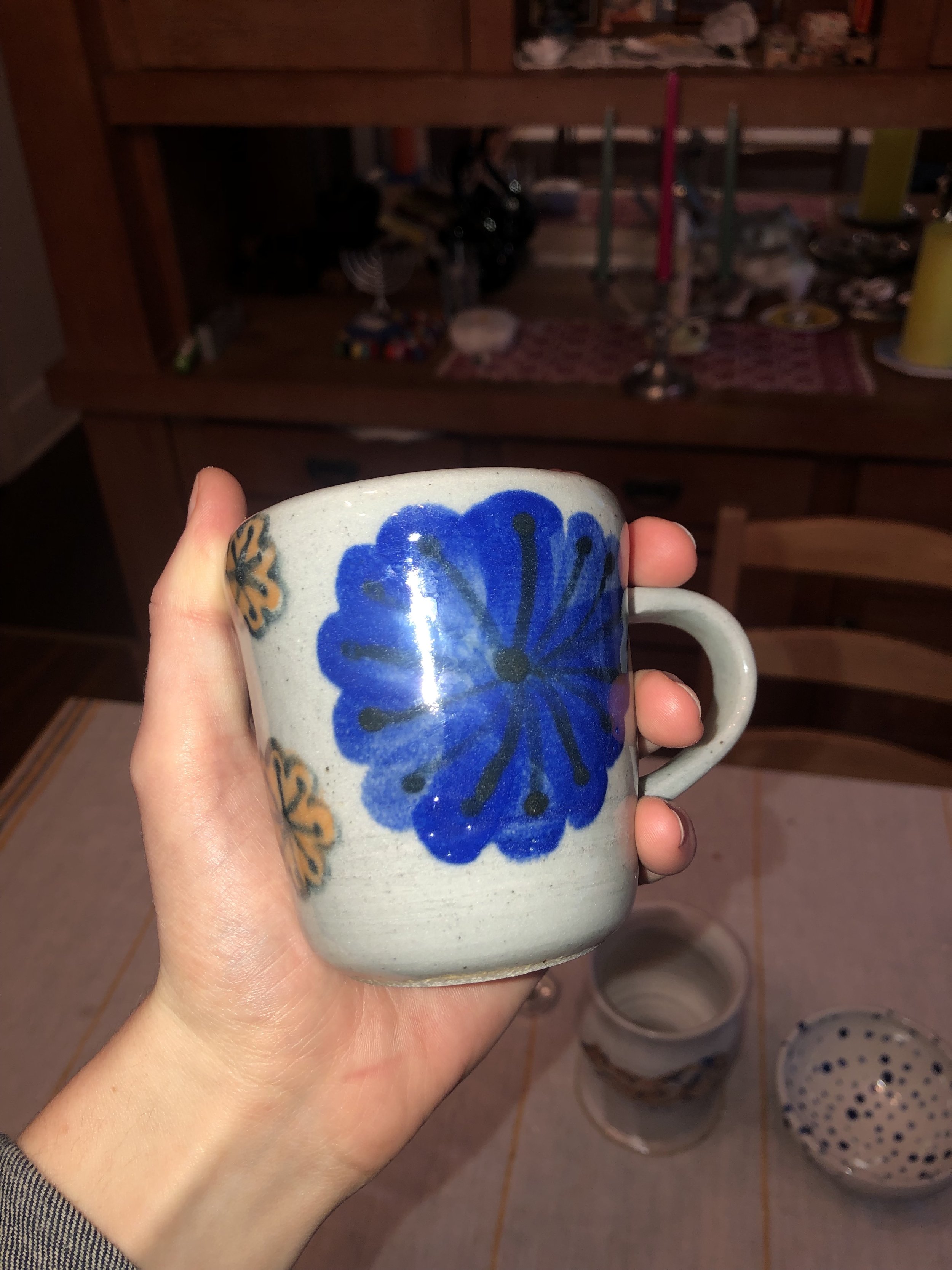 Thrown stoneware mug with colored slip and glazes. 2023.