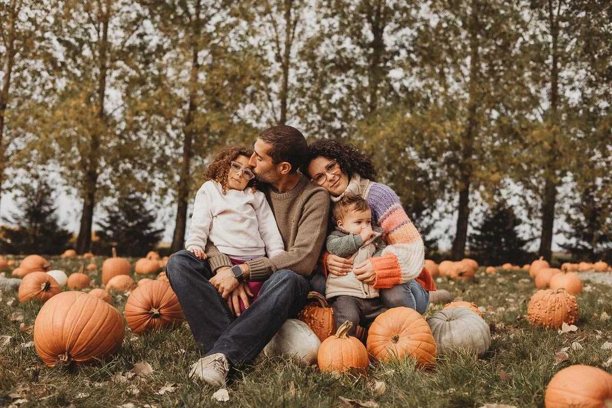 Jen Blanco's family at a pumpkin field