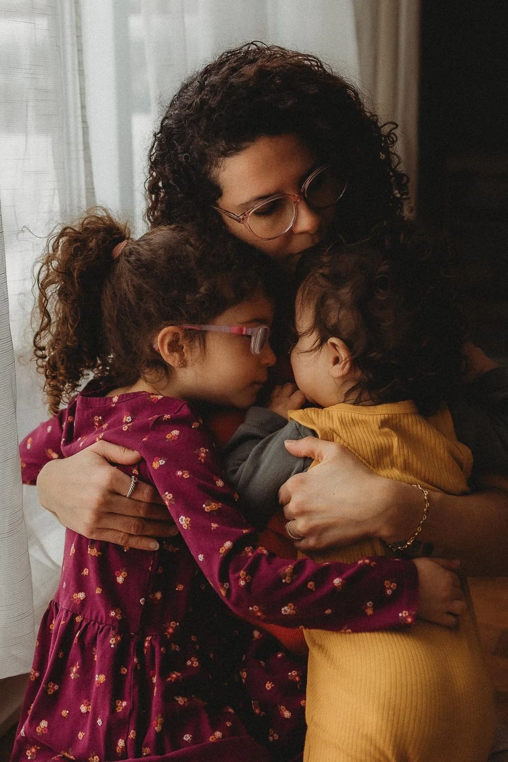Jen Blanco's self portrait with her 2 kids at home at a motherhood photo session