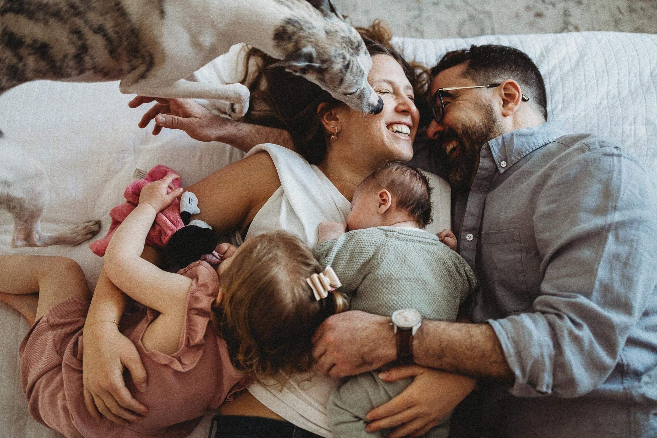 Lifestyle in-home newborn photography session in Montreal with parents and baby
