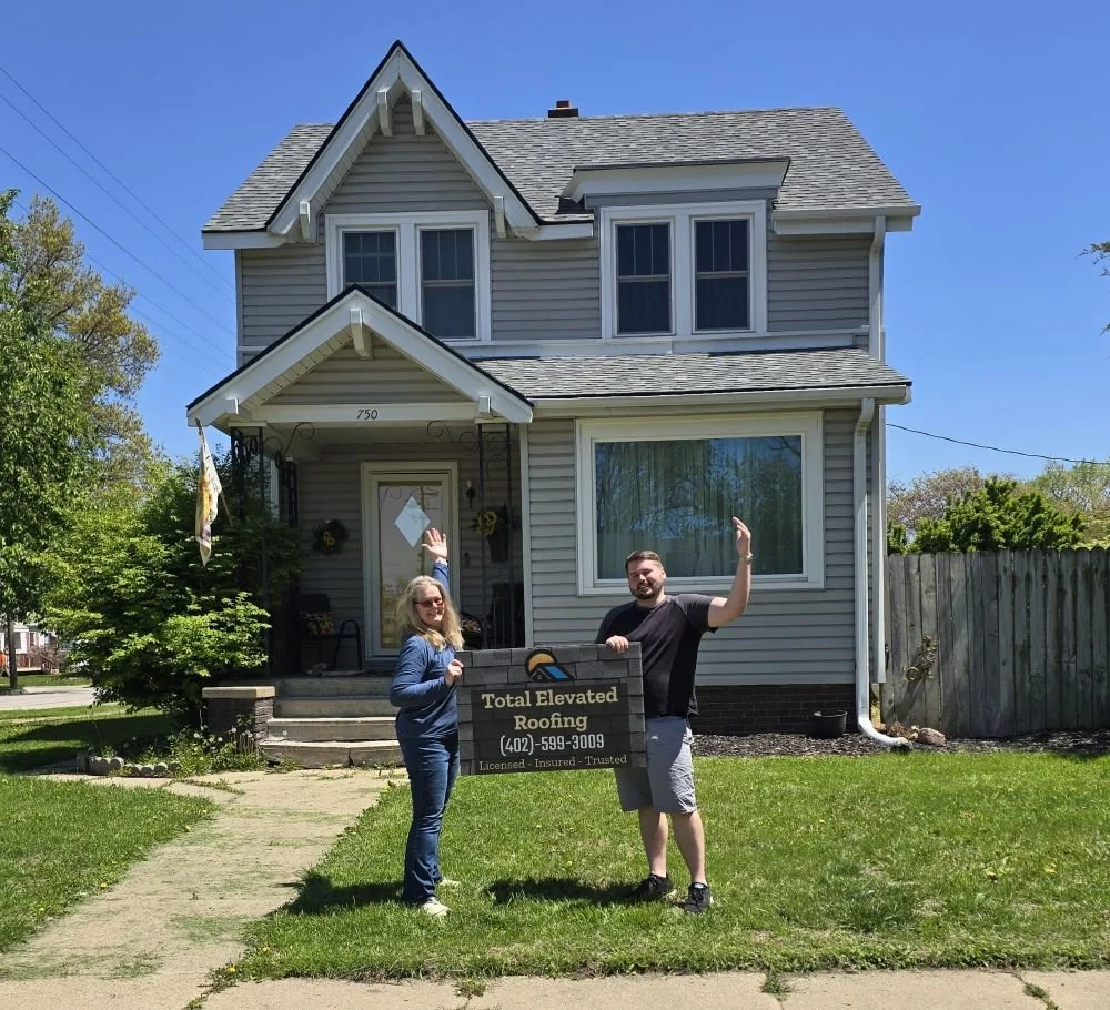 Total Elevated Roofing owner with Omaha homeowner after residential roof replacement project in Omaha Nebraska