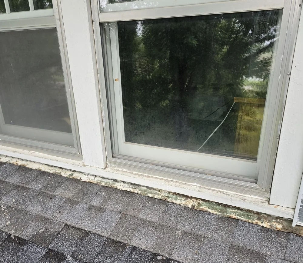 flashing where roof meets wall showing potential roof leak point