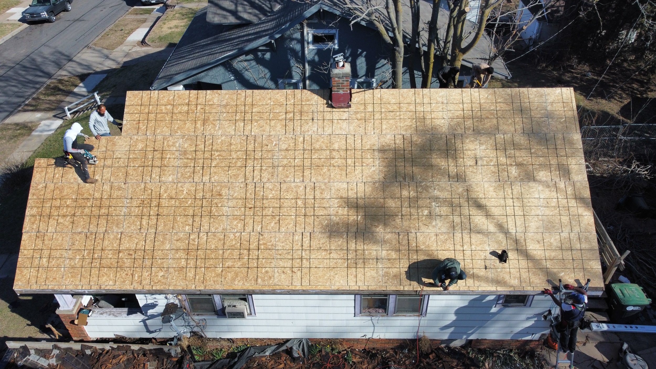 Fresh roof decking installed on Omaha home during full roof replacement after storm damage