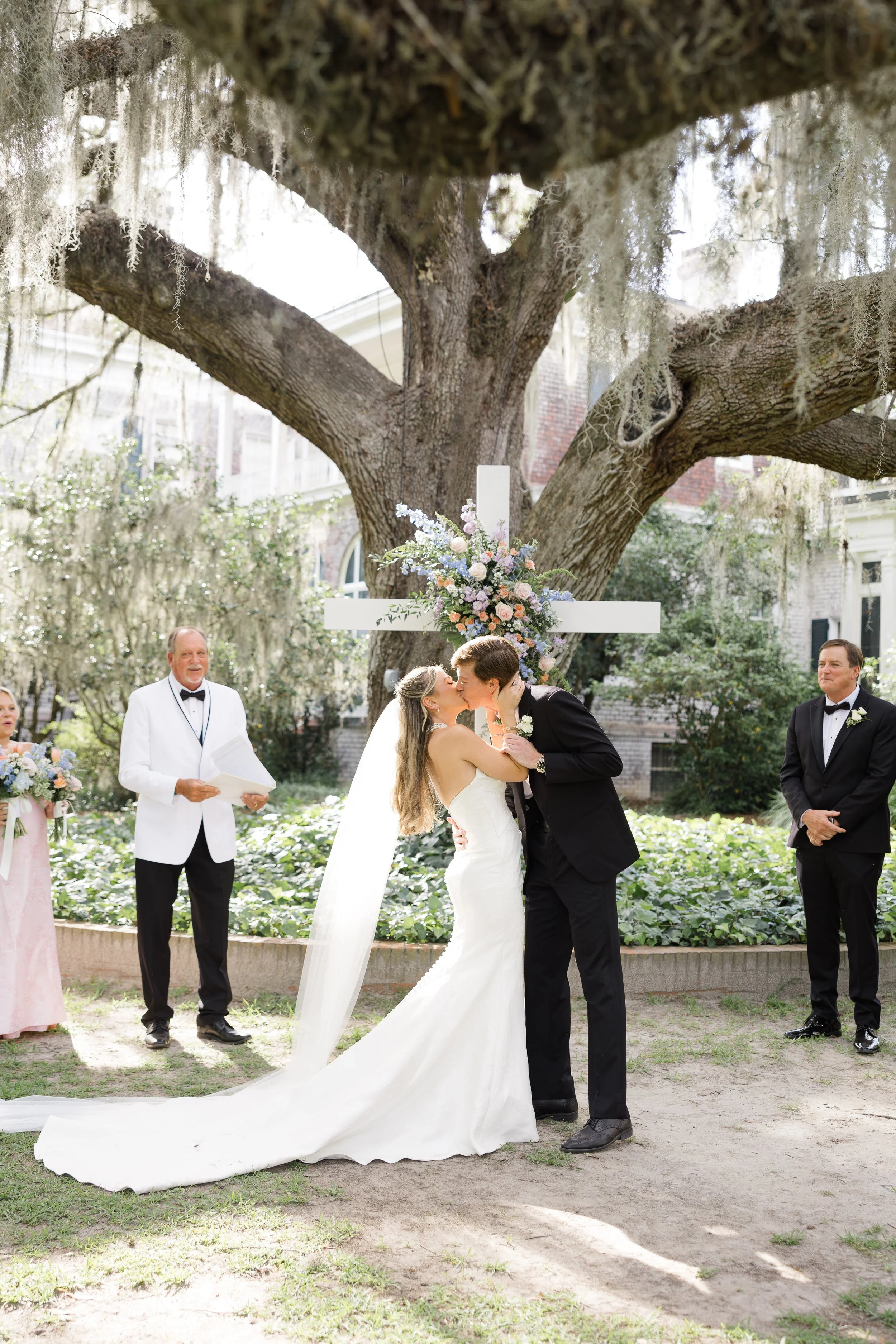 A handcrafted, white wooden cross available for weddings and events in Savannah, GA and beyond.