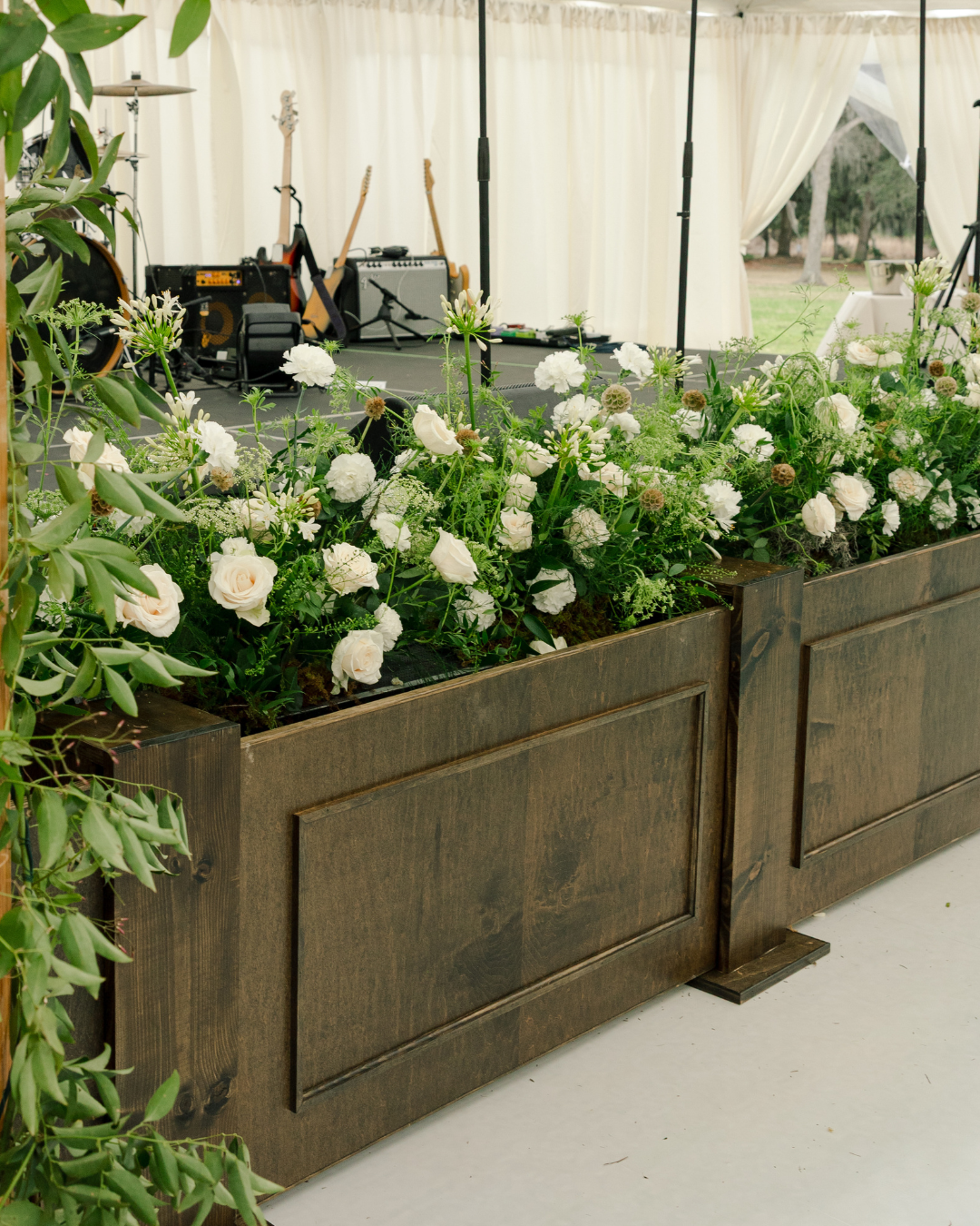 Brown wooden oak stage facade for weddings and events in Savannah, GA and beyond.