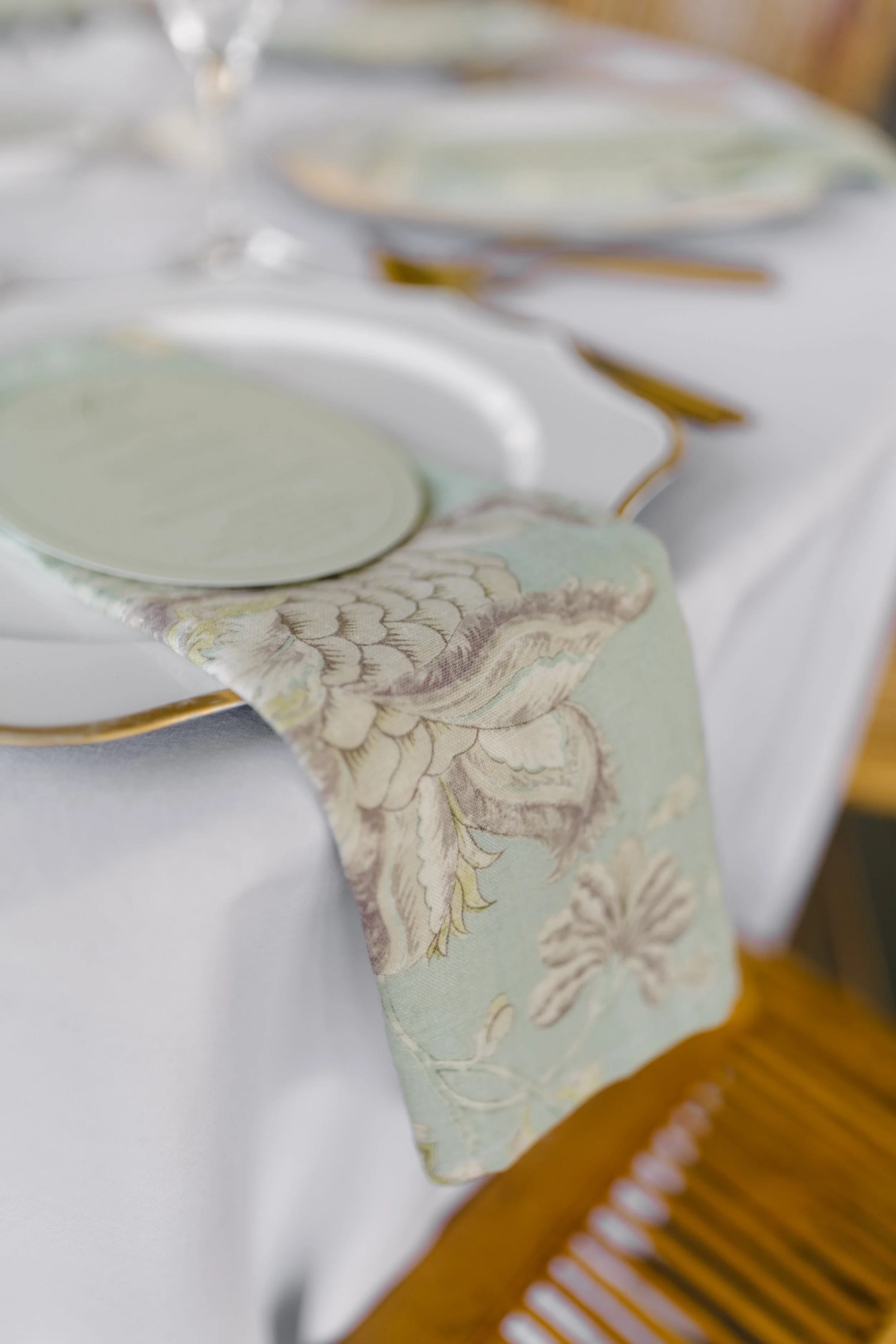 Blue, green and ivory floral linen napkin for event and wedding rentals