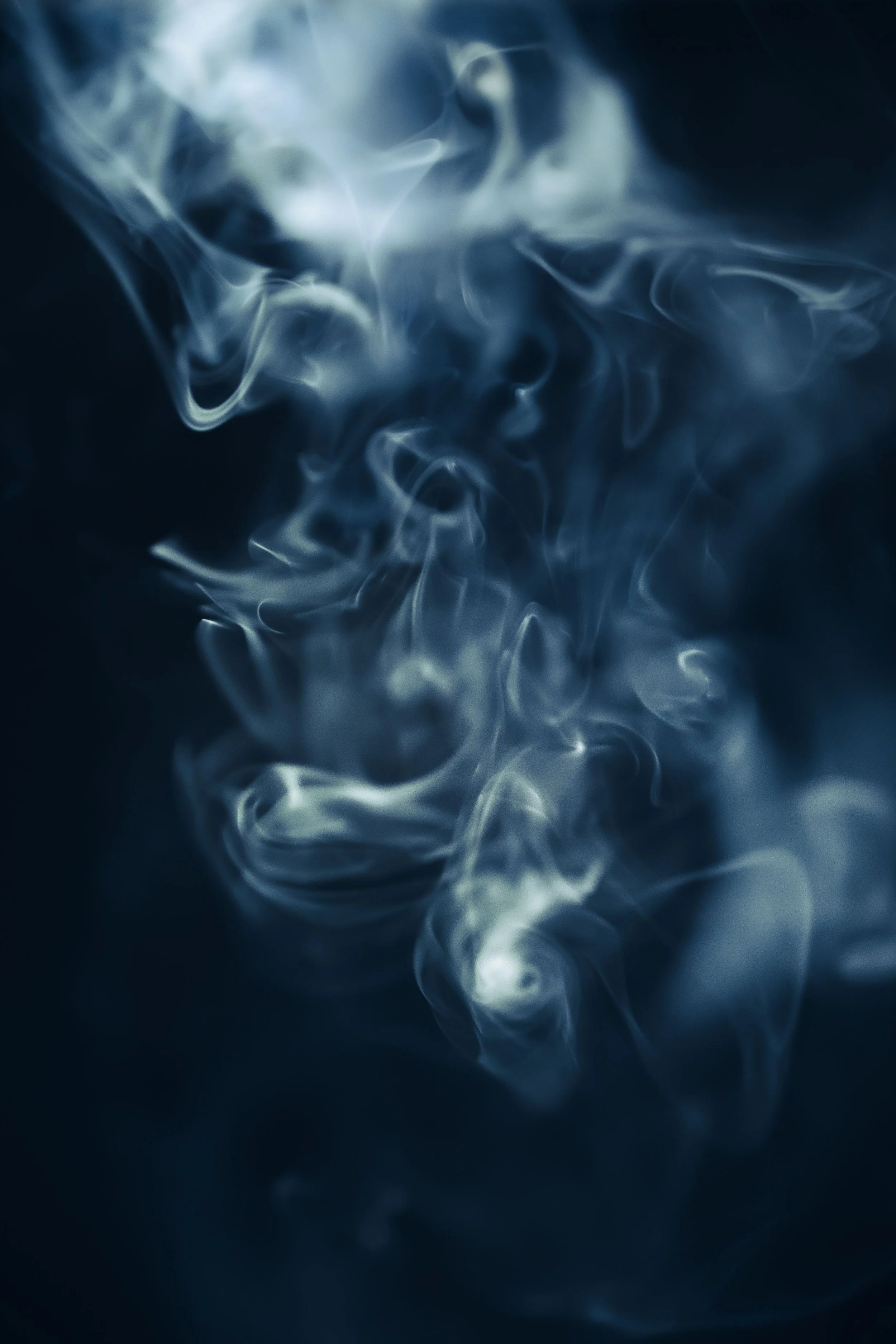 Photo of incense smoke on black background.jpg