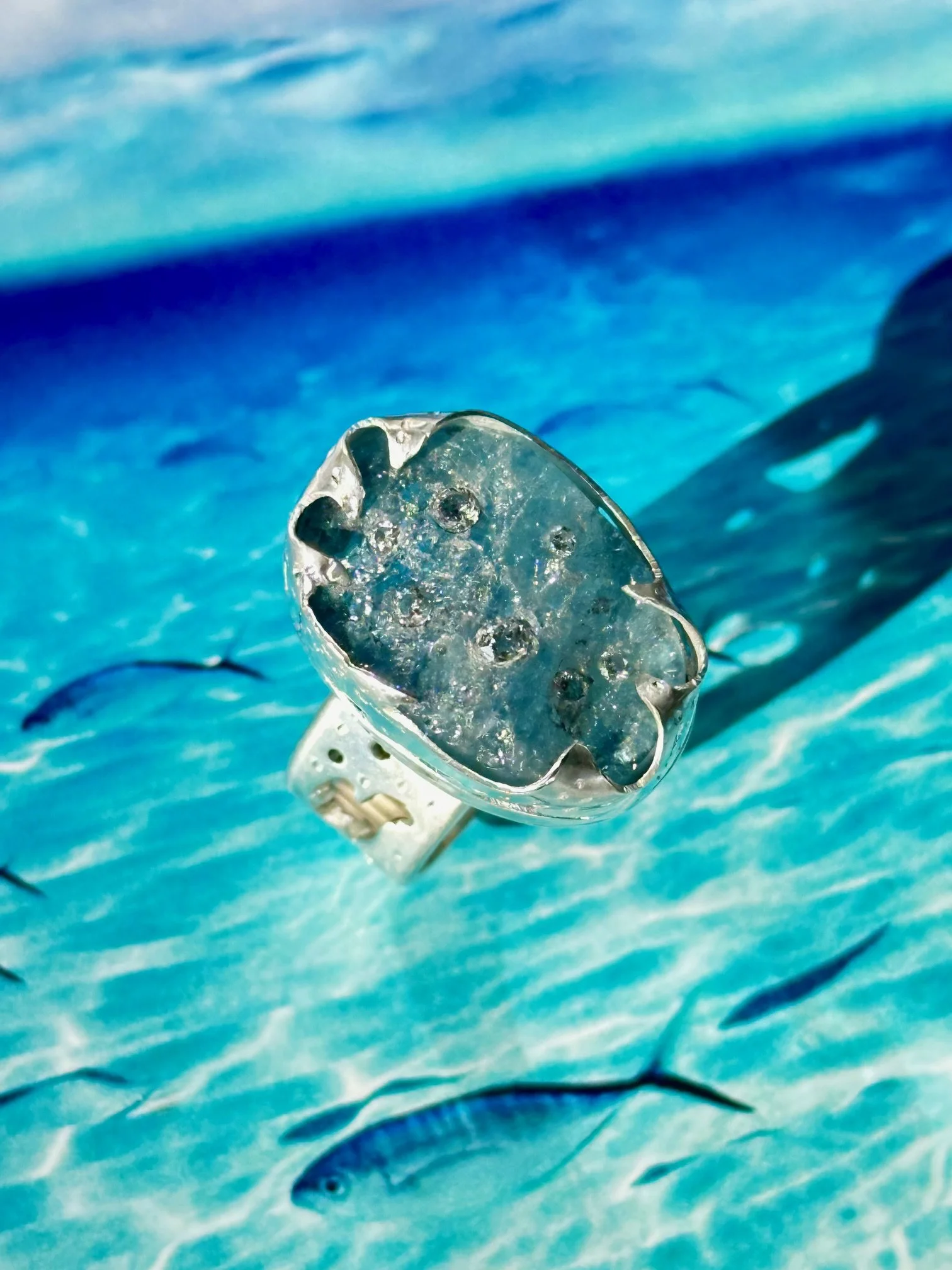 Aquamarine with inlaid diamond wave ring.jpeg