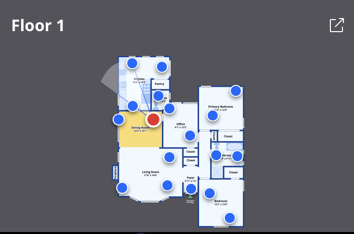 Floor plan of a house showing rooms such as living room, dining room, kitchen, pantry, office, primary bedroom, bedroom, bathrooms, and closets, with blue markers indicating specific points of interest.