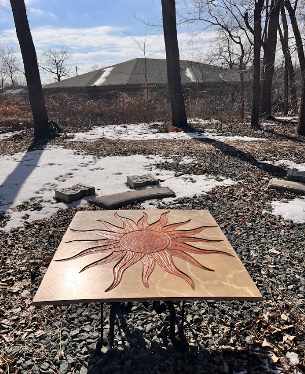 Our stone sun table will sit as a centerpiece to our walking path.  Everyone is welcome at our table and we hope you'll linger and enjoy the space.