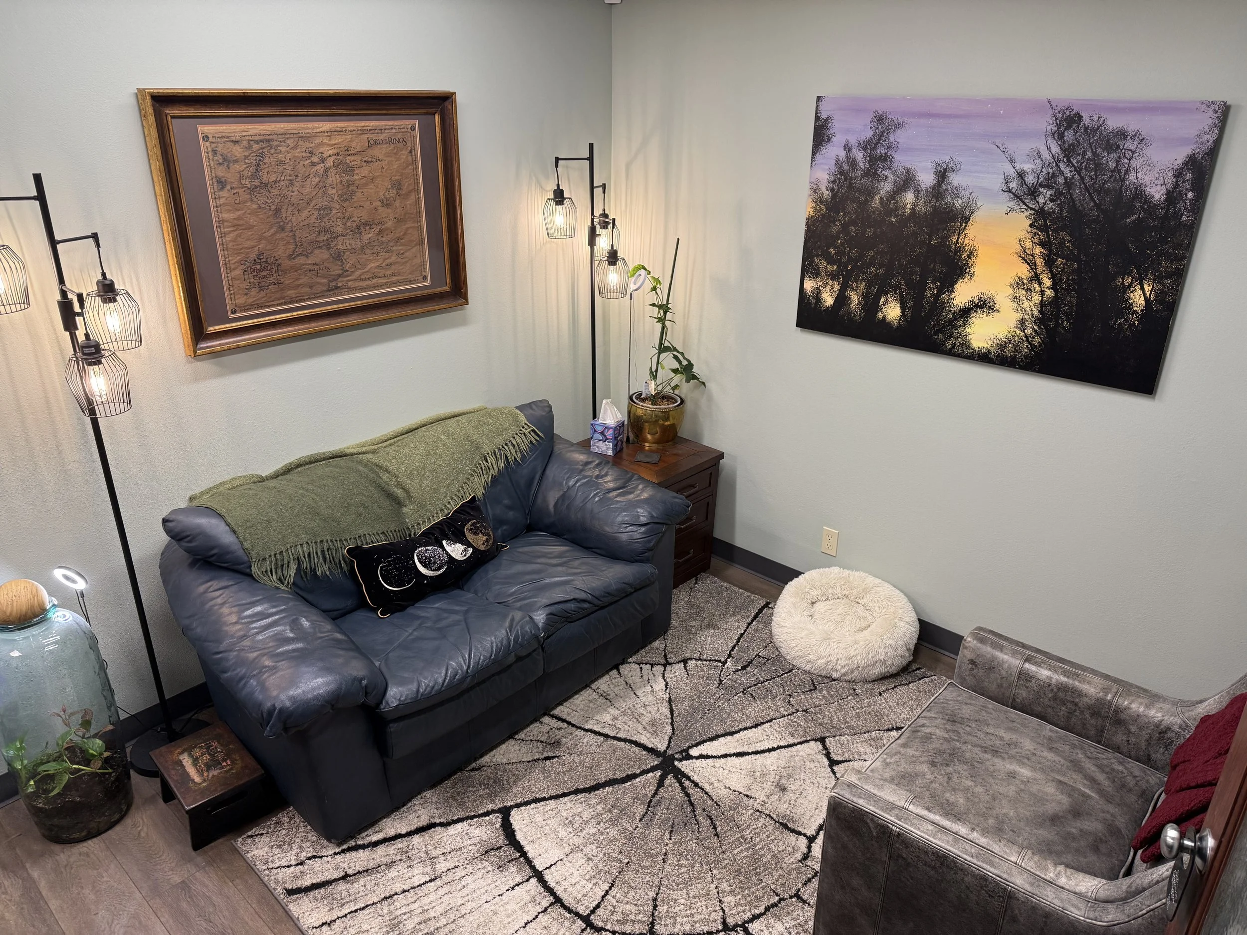 office with a loveseat and art on the walls