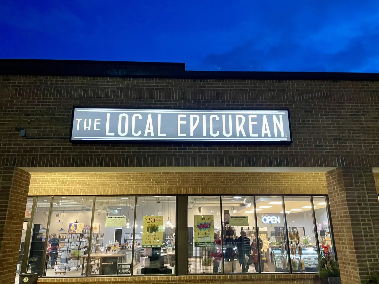 The Local Epicurean East Lansing storefront at dusk