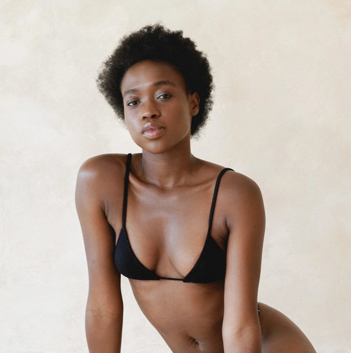 Women's ribbed ECOVERO triangle bra in black, worn, front view
