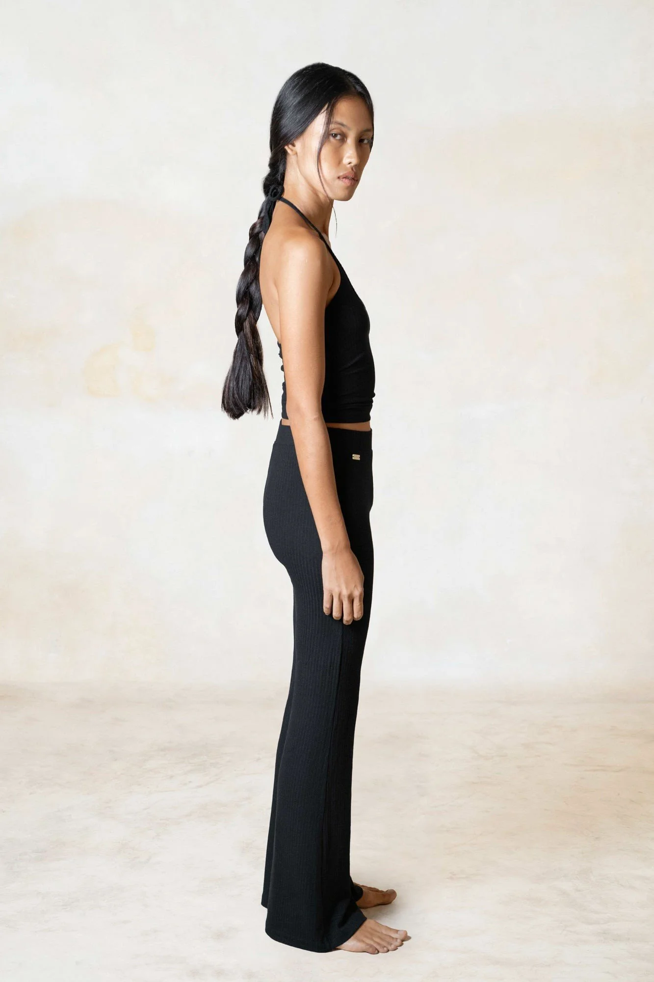 Women's ribbed ECOVERO flares in black, worn, side view