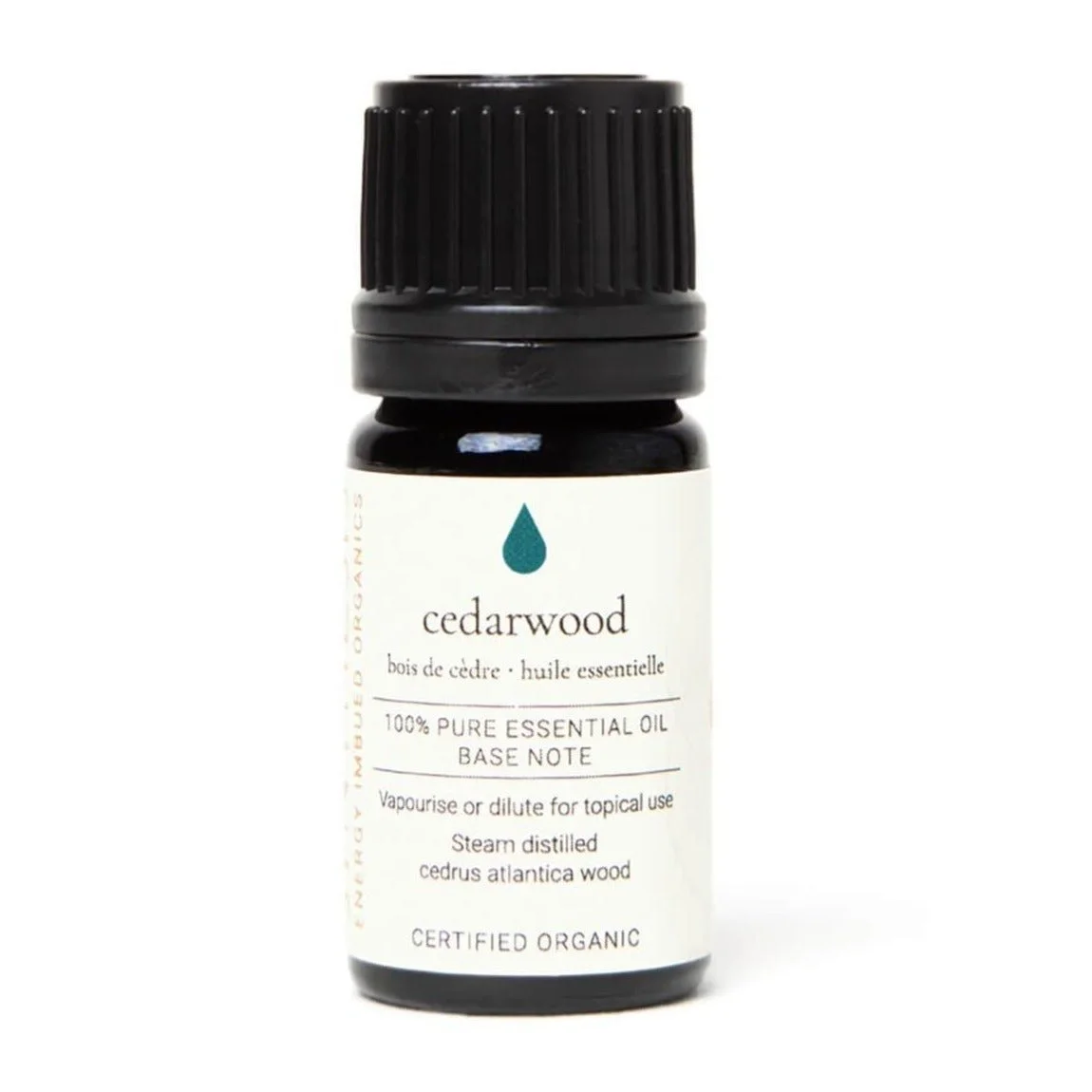 Cedarwood organic essential oil, dark glass bottle on white