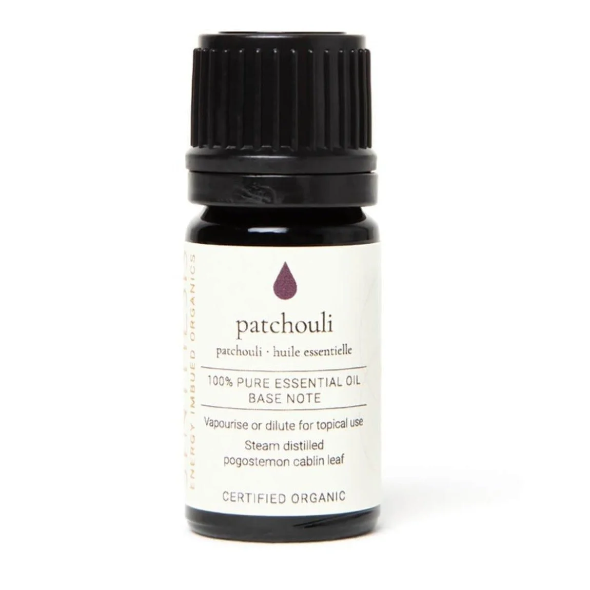 Patchouli organic essential oil, dark glass bottle on white
