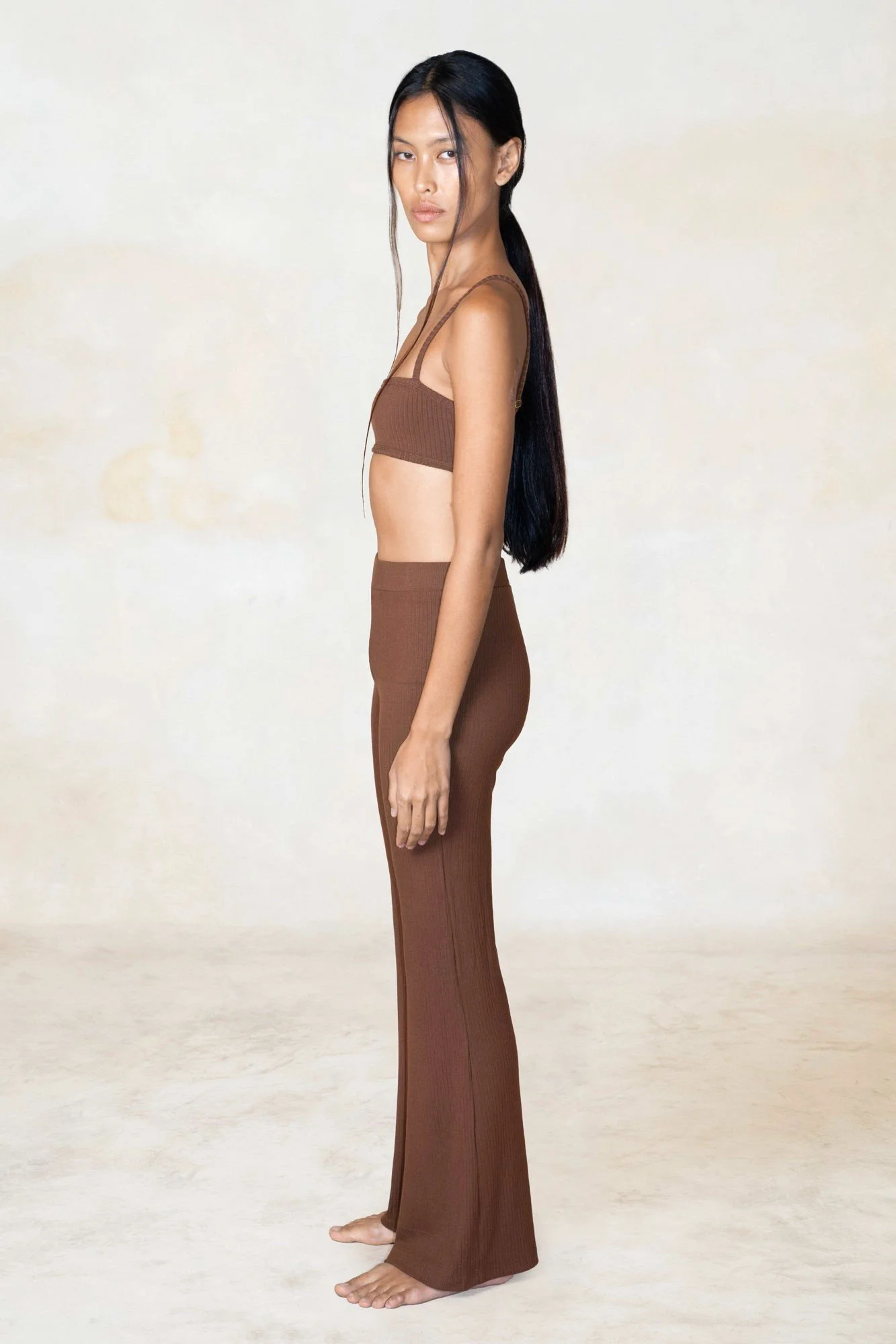 Women's ribbed ECOVERO flares in chocolate, worn, side view