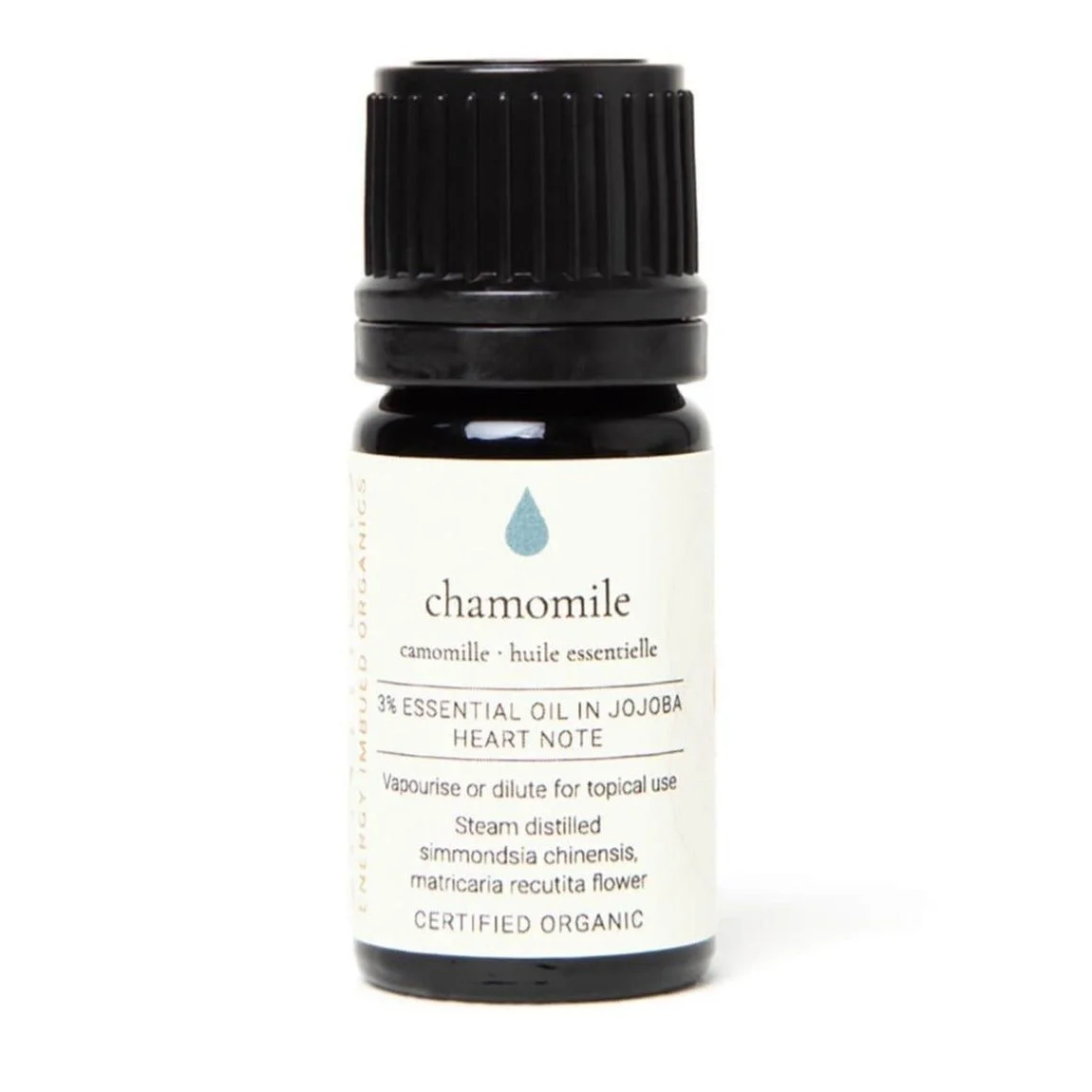 Chamomile organic essential oil in jojoba, dark glass bottle on white