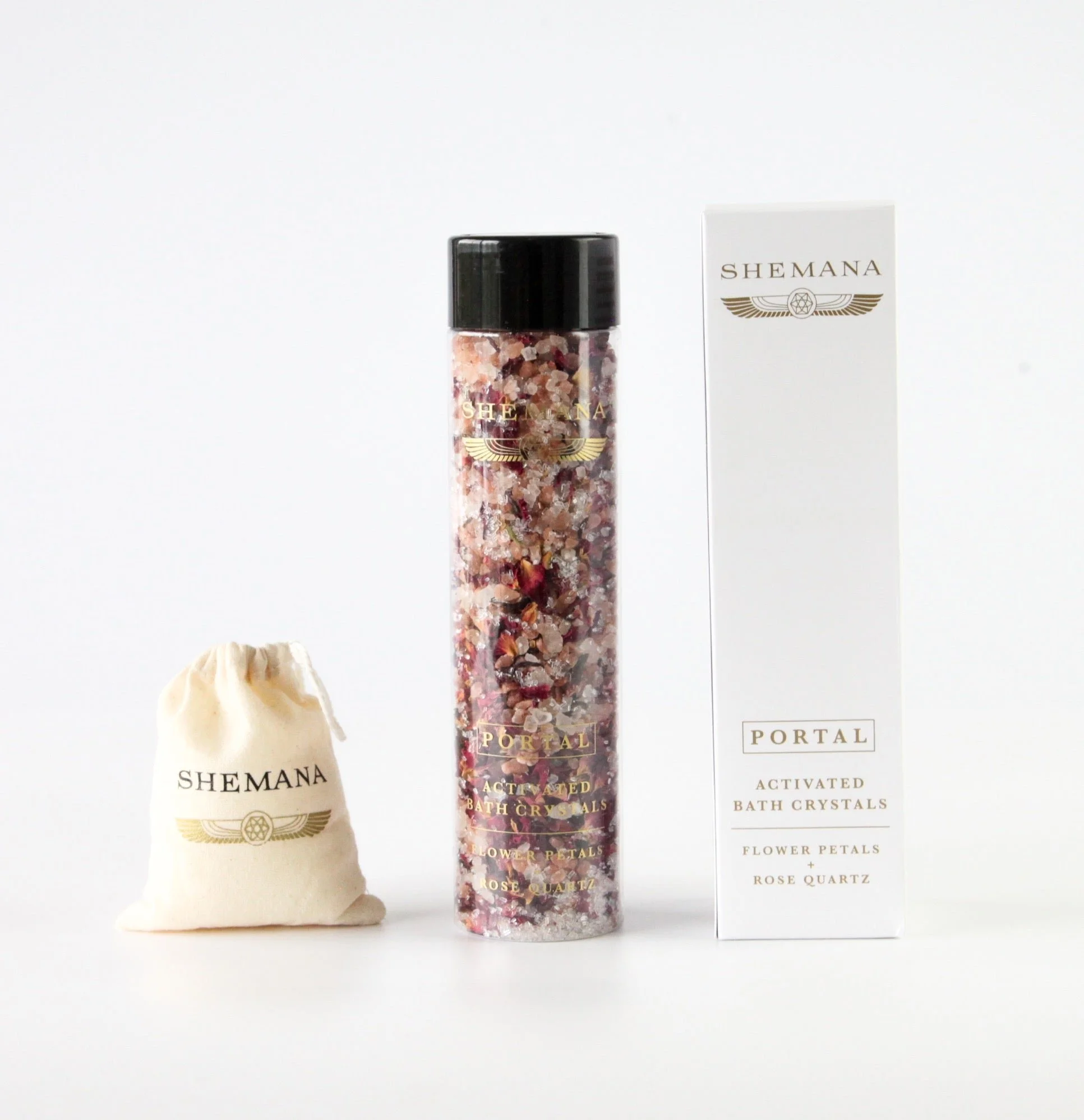 Activated mineral bath crystals with rose petals in a glass tube, with box and cotton pouch