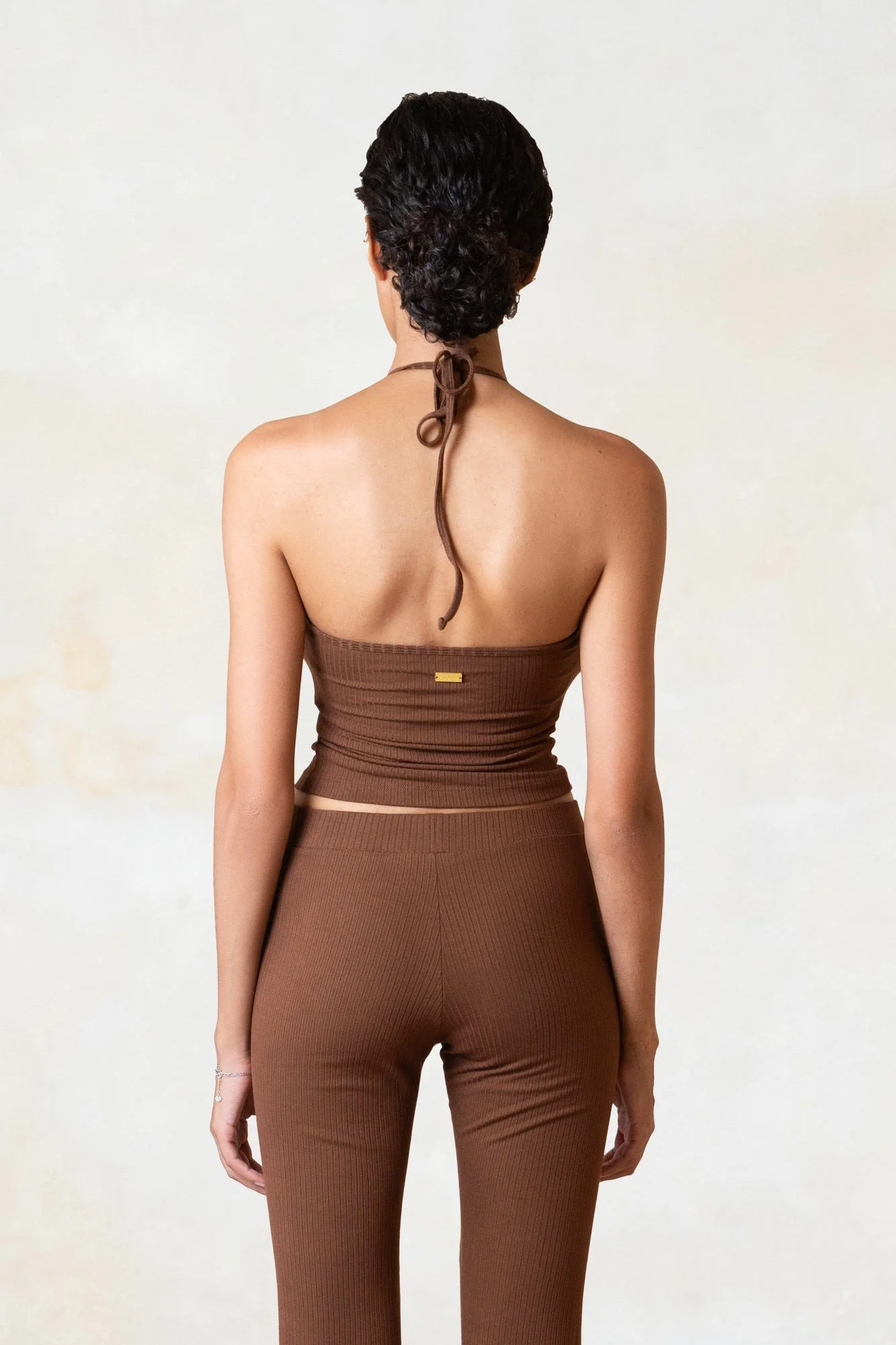 Women's ribbed ECOVERO halter top in chocolate, back view showing the neck ties