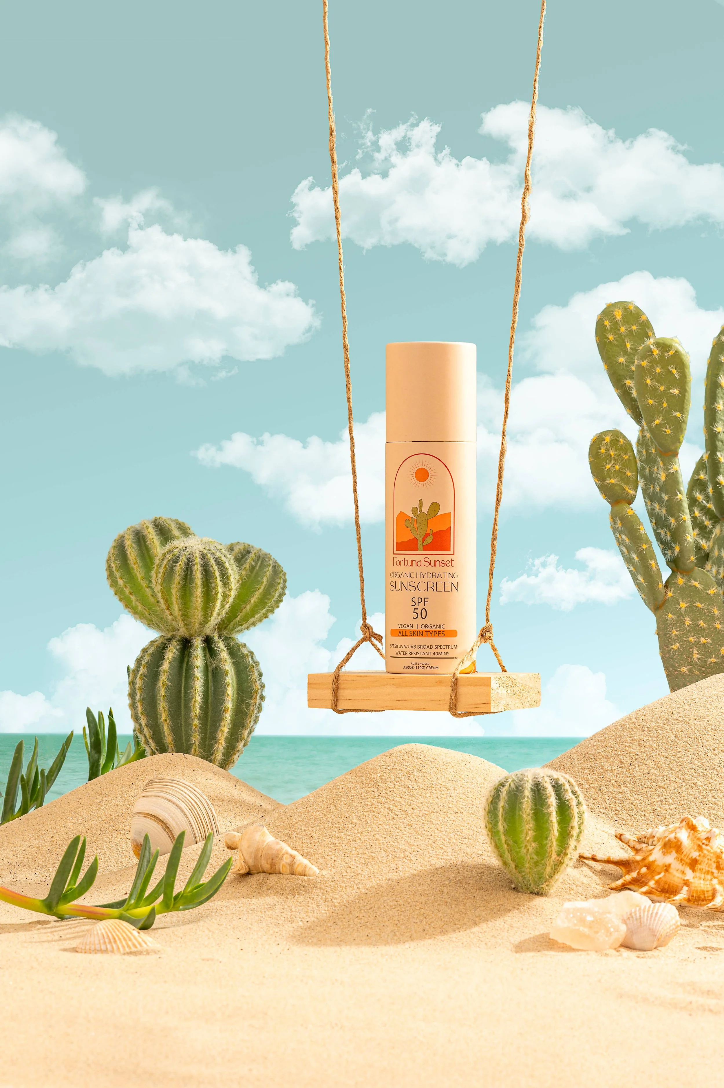 Organic zinc sunscreen SPF 50 bottle on a rope swing in a sand and cactus set