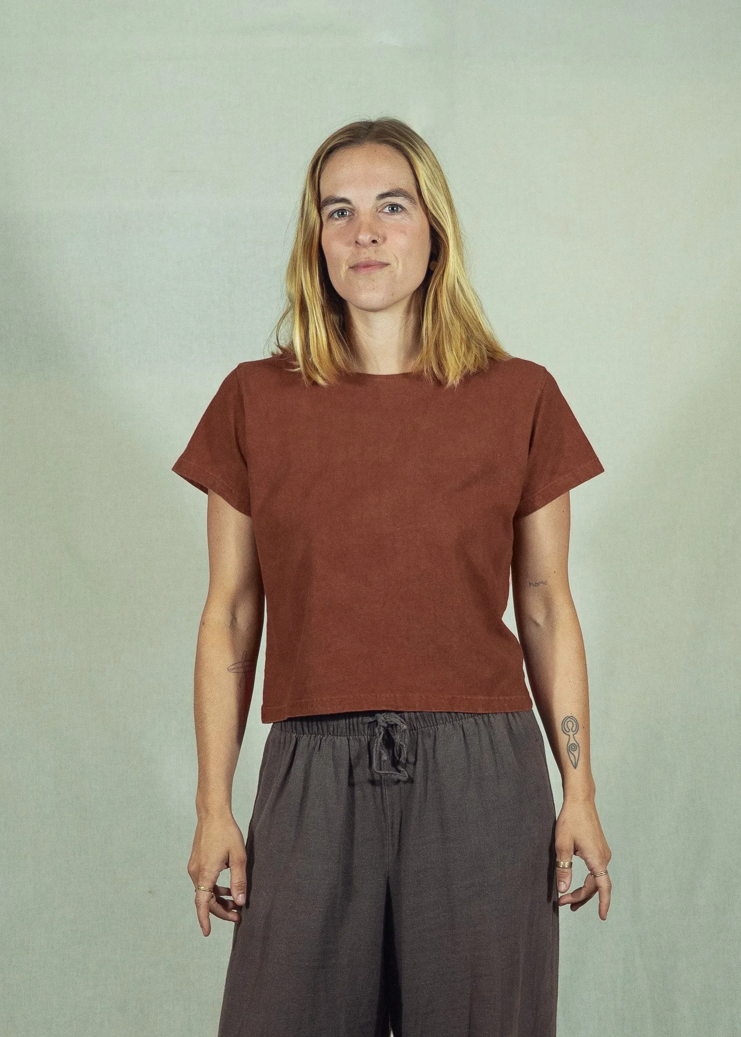 Women's cropped plant dyed hemp tee in madder root, studio front view