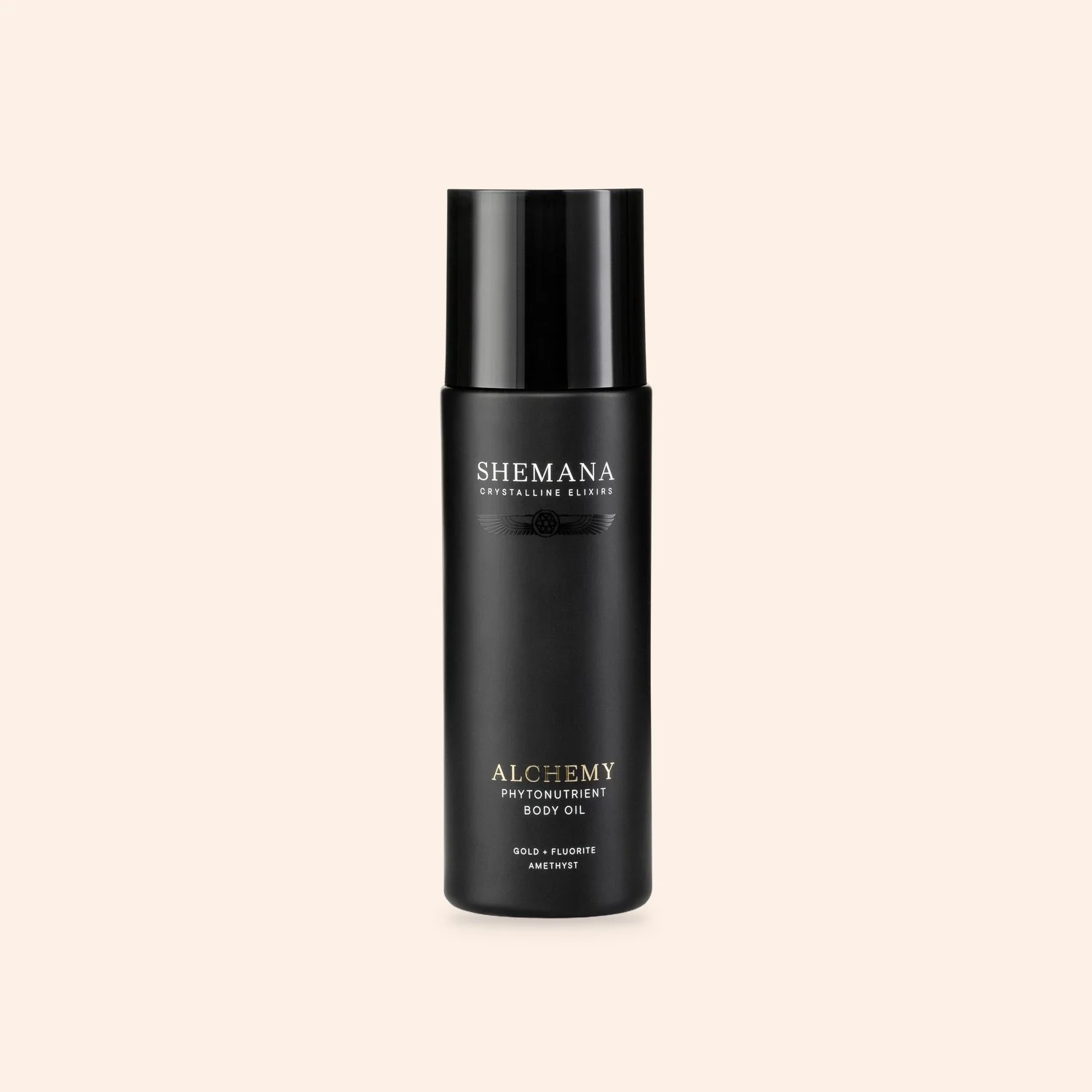 Alchemy Body & Bath Oil 100ml, black bottle on a peach background