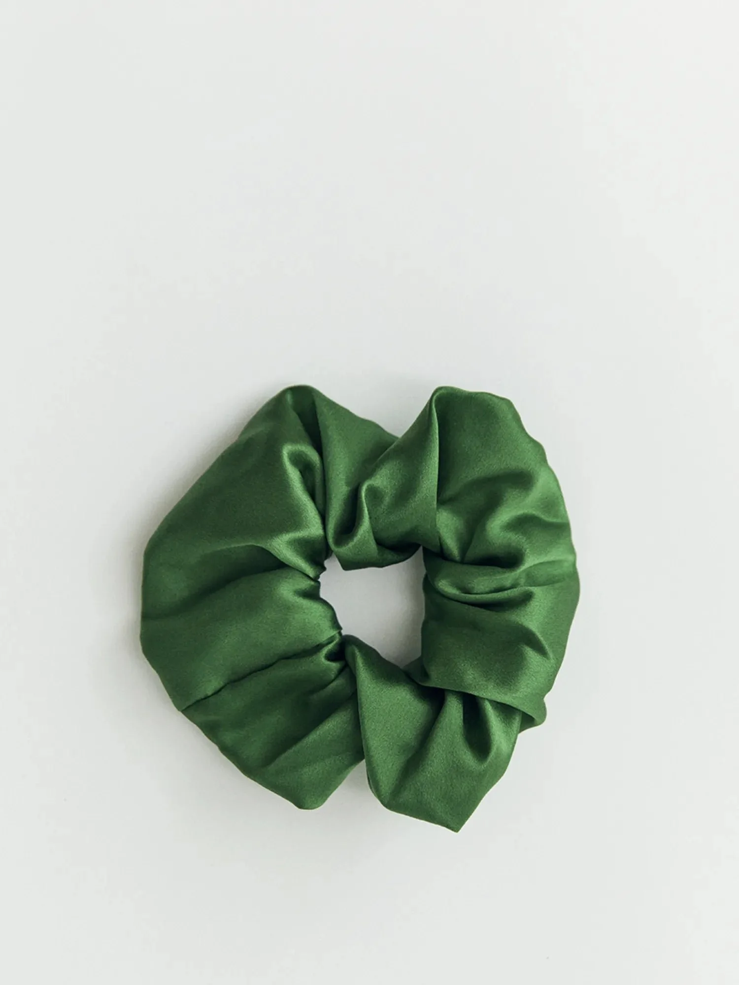 Mulberry silk scrunchie in forest, on white