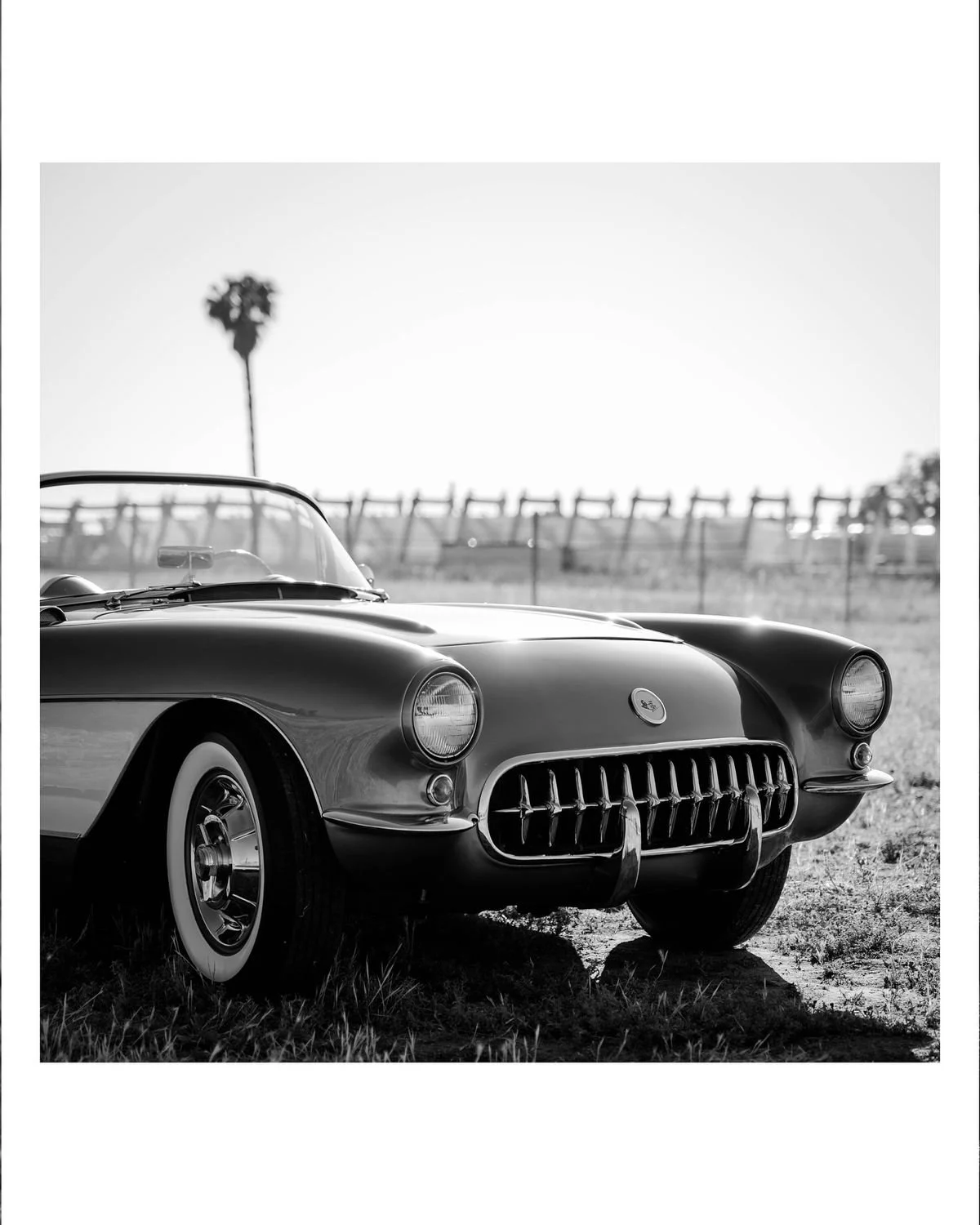 Black and White photo of a fancy classic car