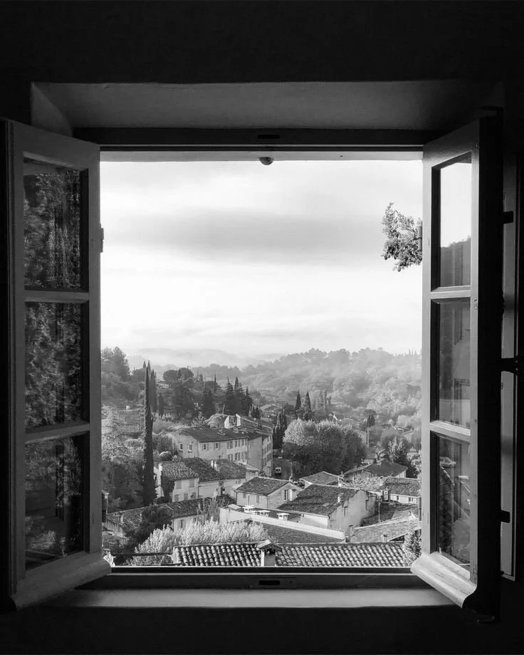 Picture of far away landscape outside of a window