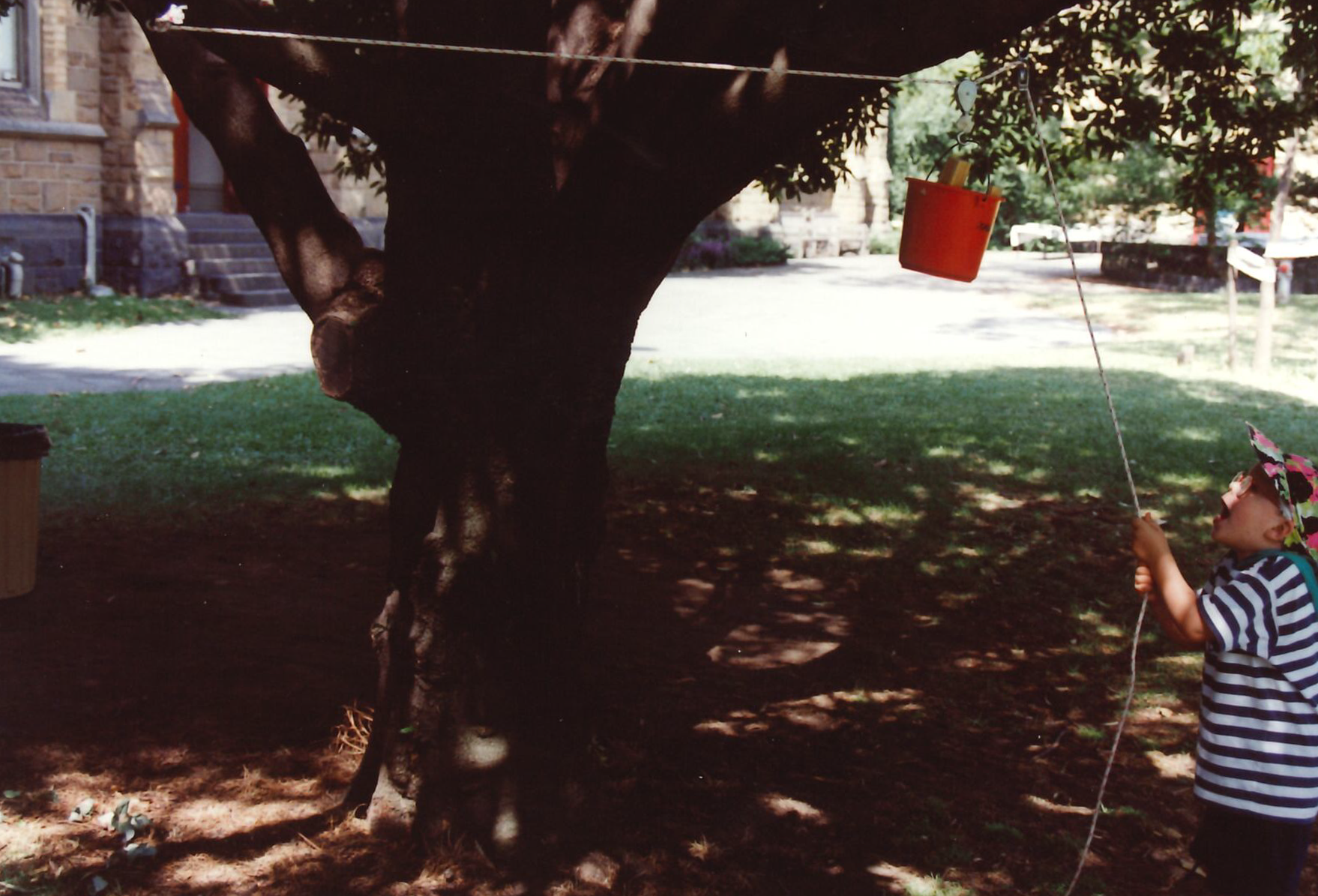 play summit 93 - kid and rope pulley.png