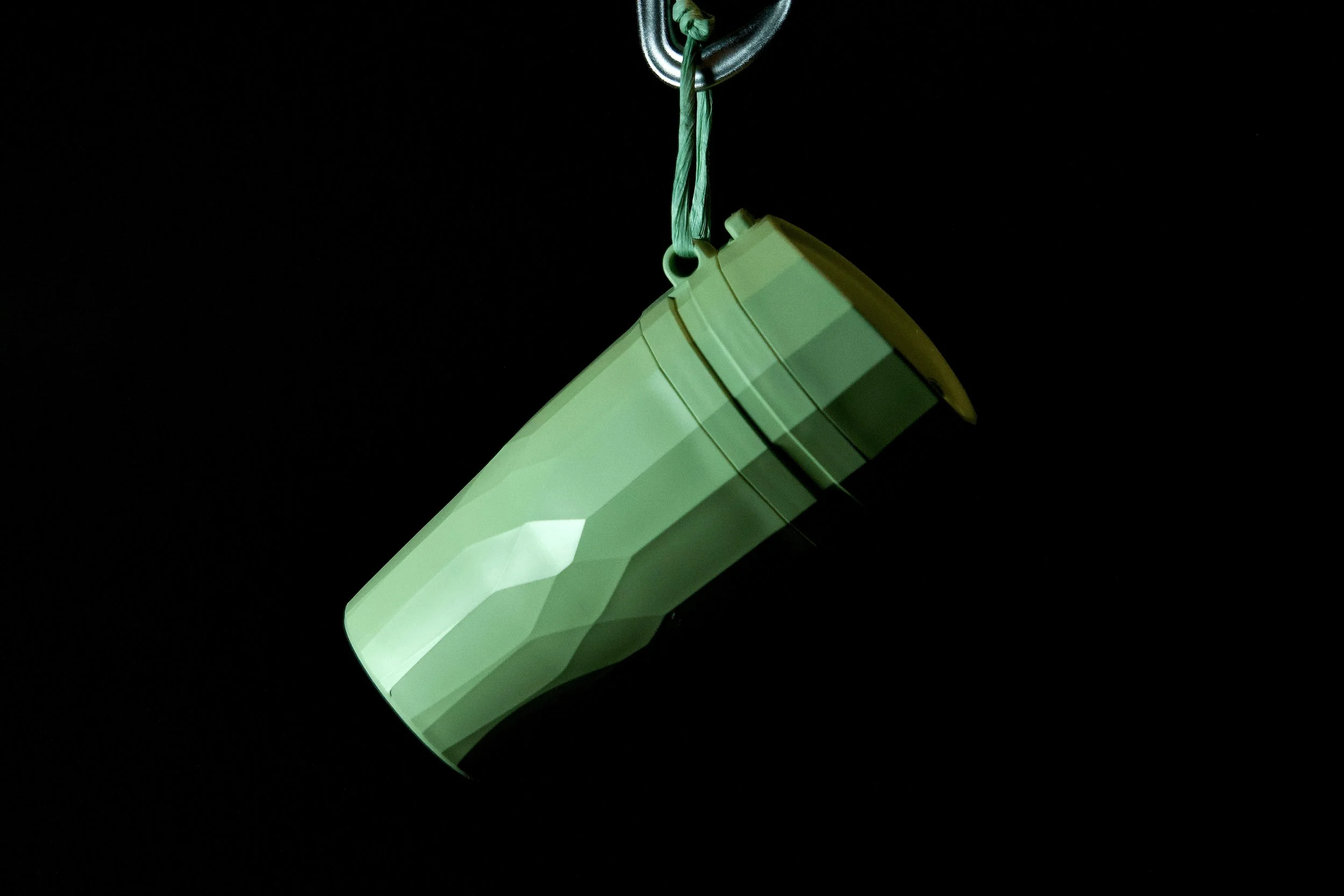 Väki final green hanging on studio black.jpeg