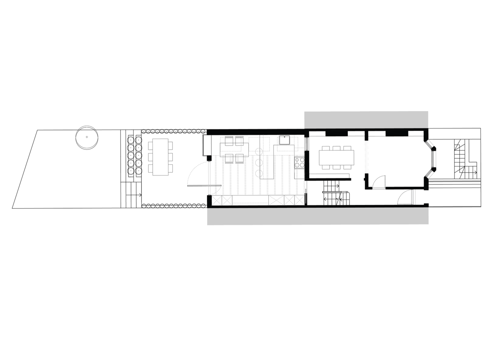Floor plan of a narrow house with outdoor yard, dining area, kitchen, living room, and stairs.