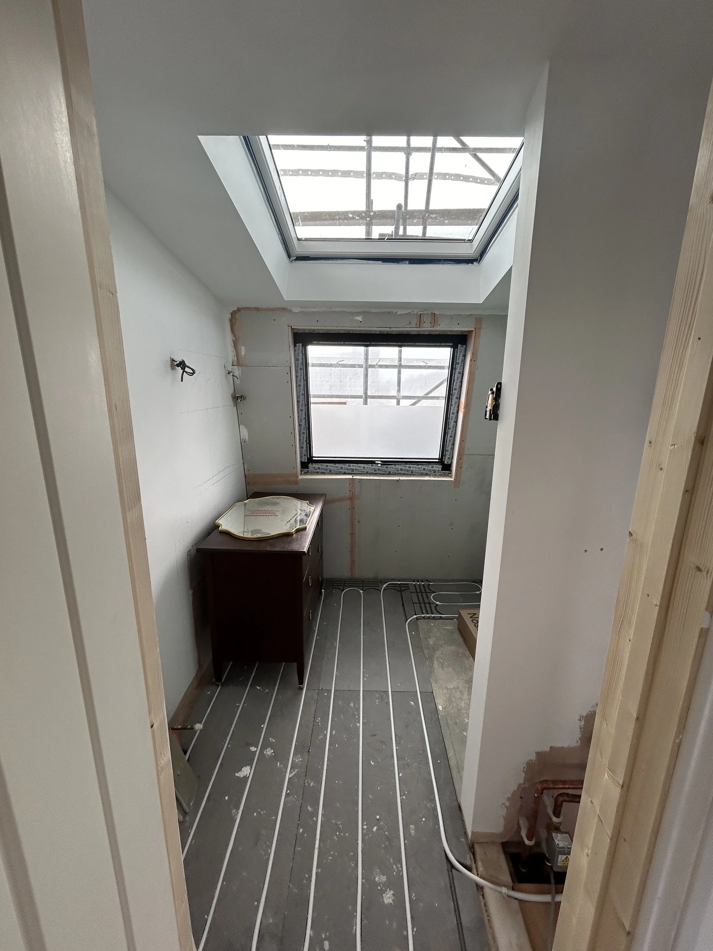 We incorporated a large bathroom in this mansard roof extension.