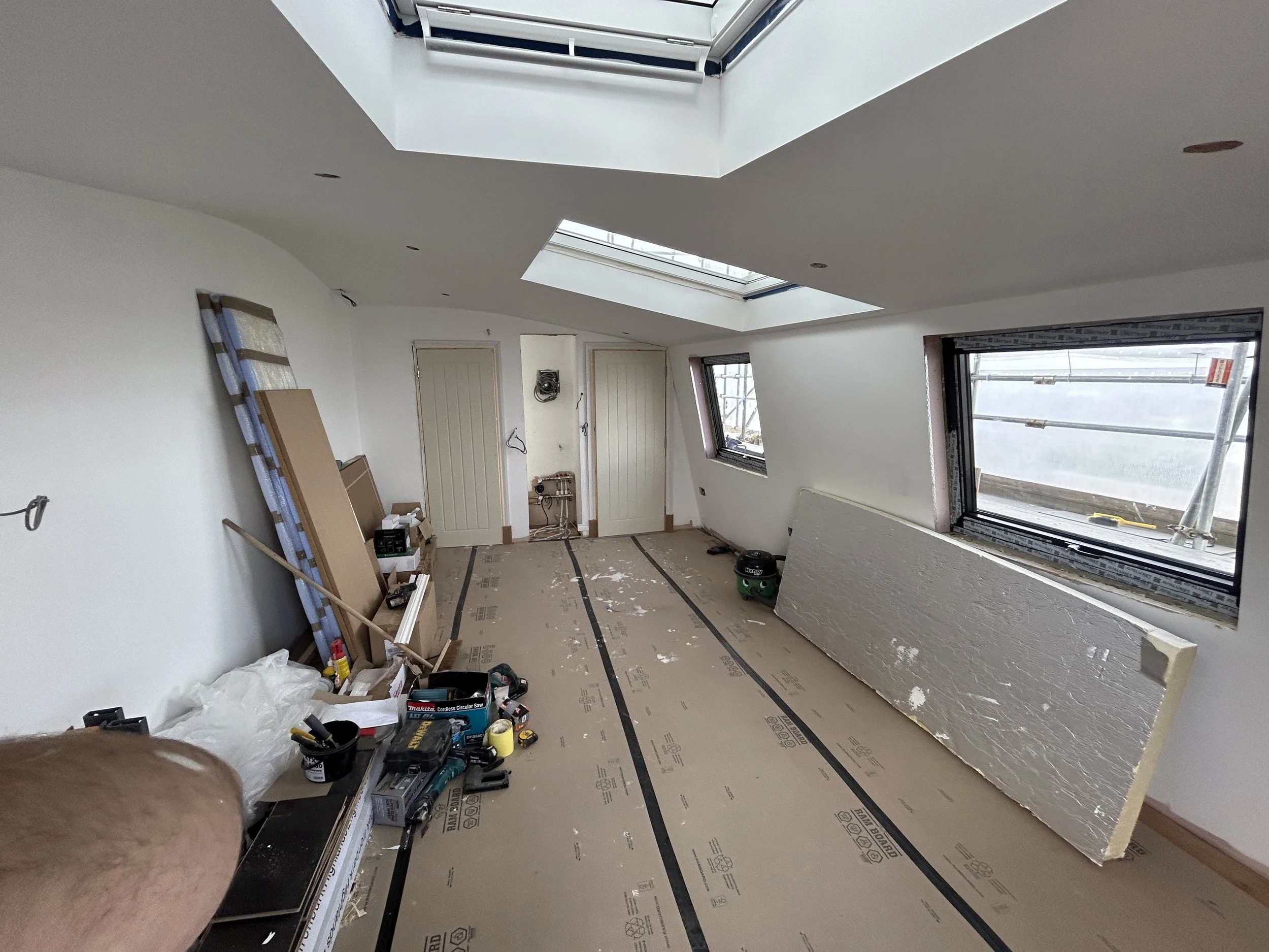 We used aluminum windows on the mansard walls which look much nicer than Velux.