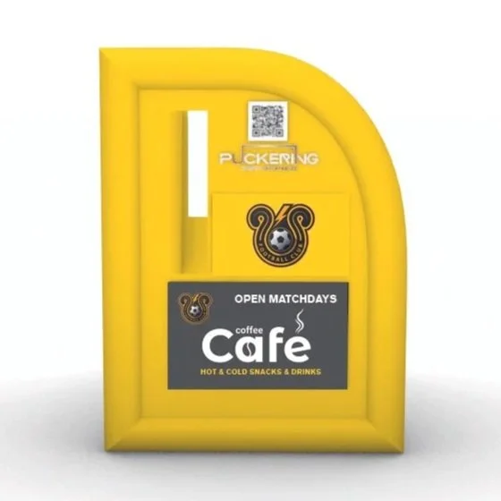 Yellow locker with various stickers and a sign for a coffee café that includes cold snacks and drinks.