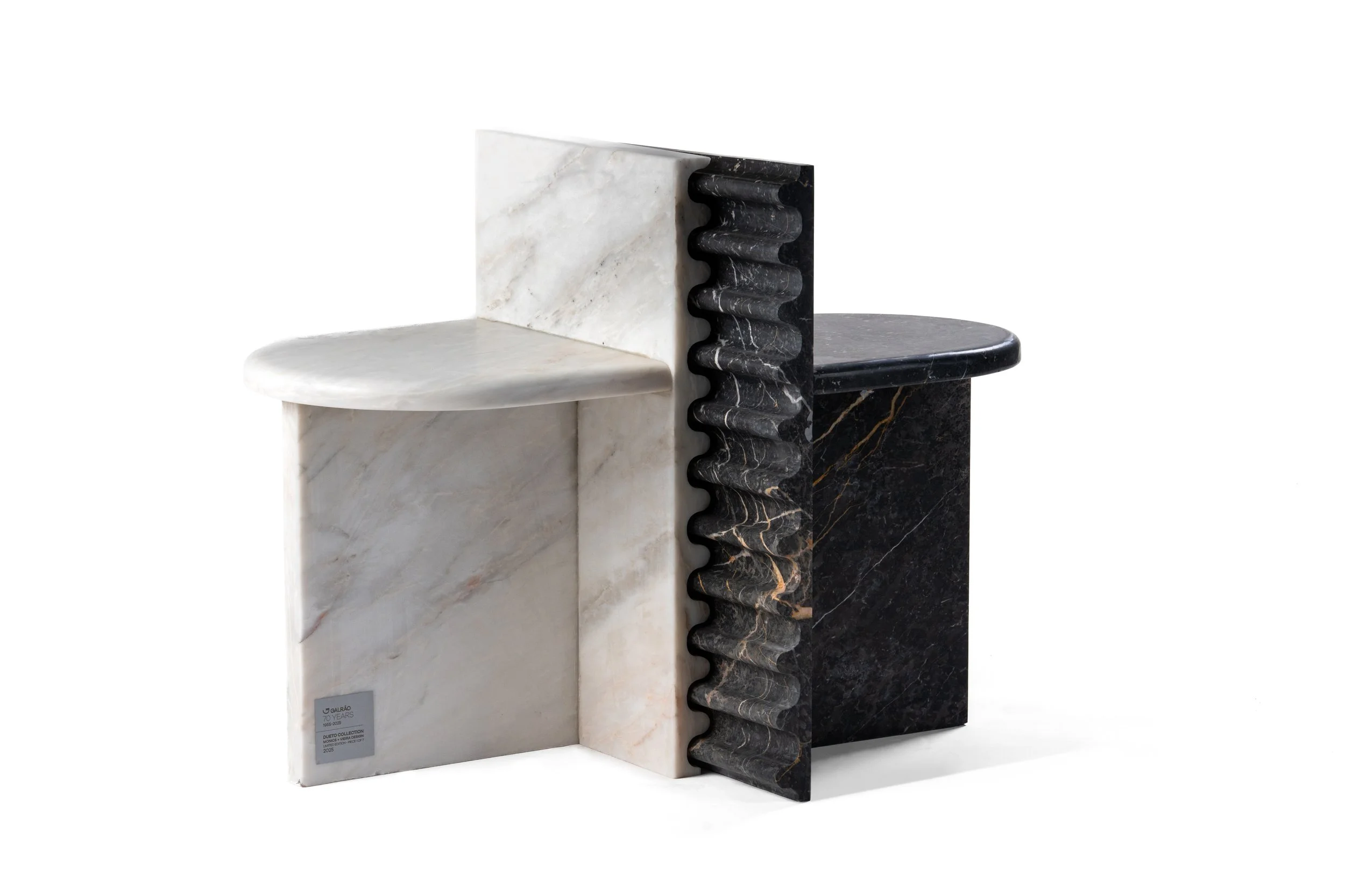 A display of three marble samples in white, black, and dark brown, arranged vertically against a white background.