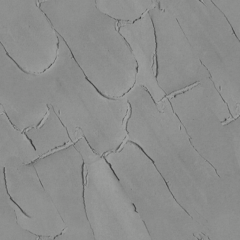Close-up of a textured cracked white wall surface.