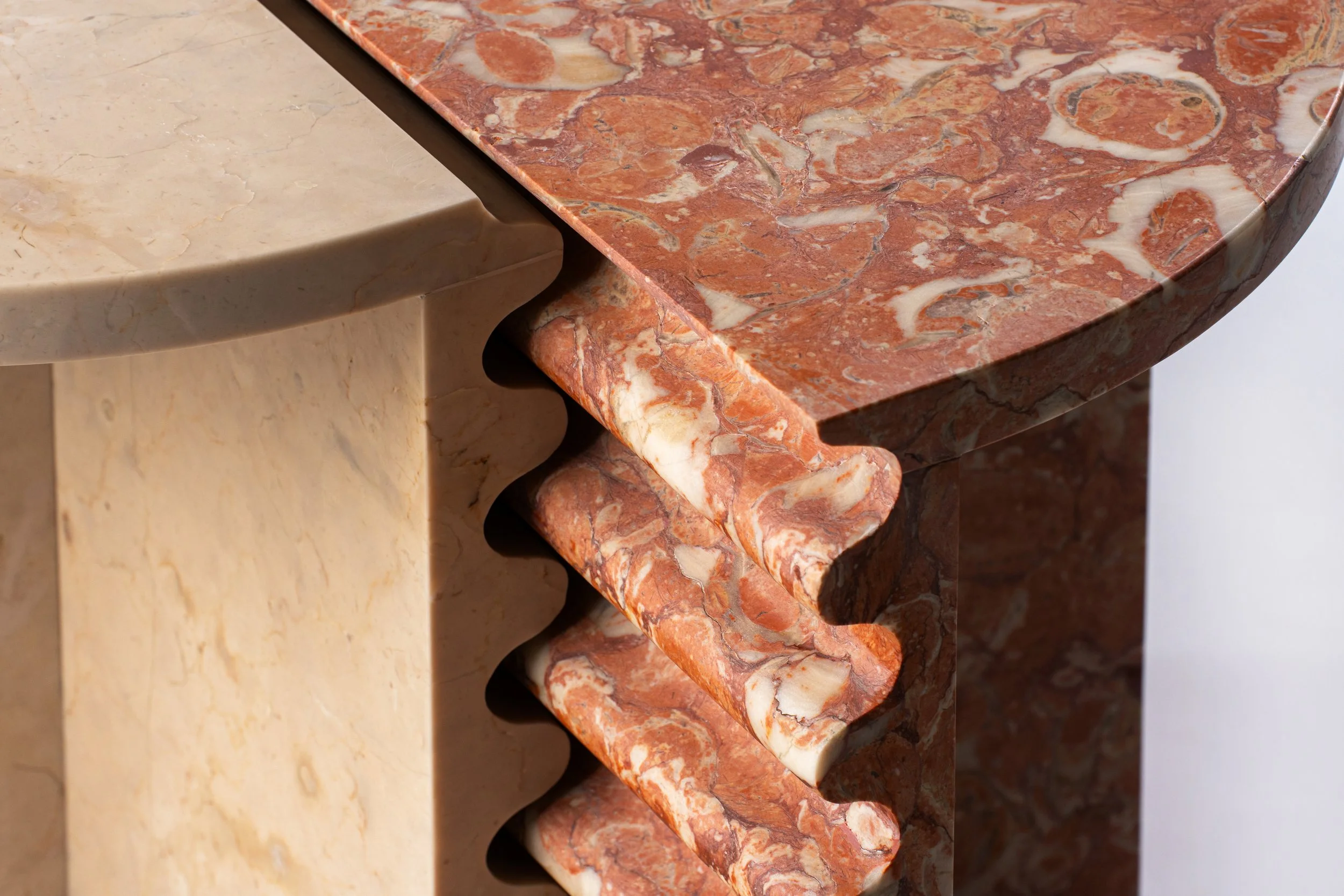 Close-up of three different types of marble countertops with various colors and patterns.