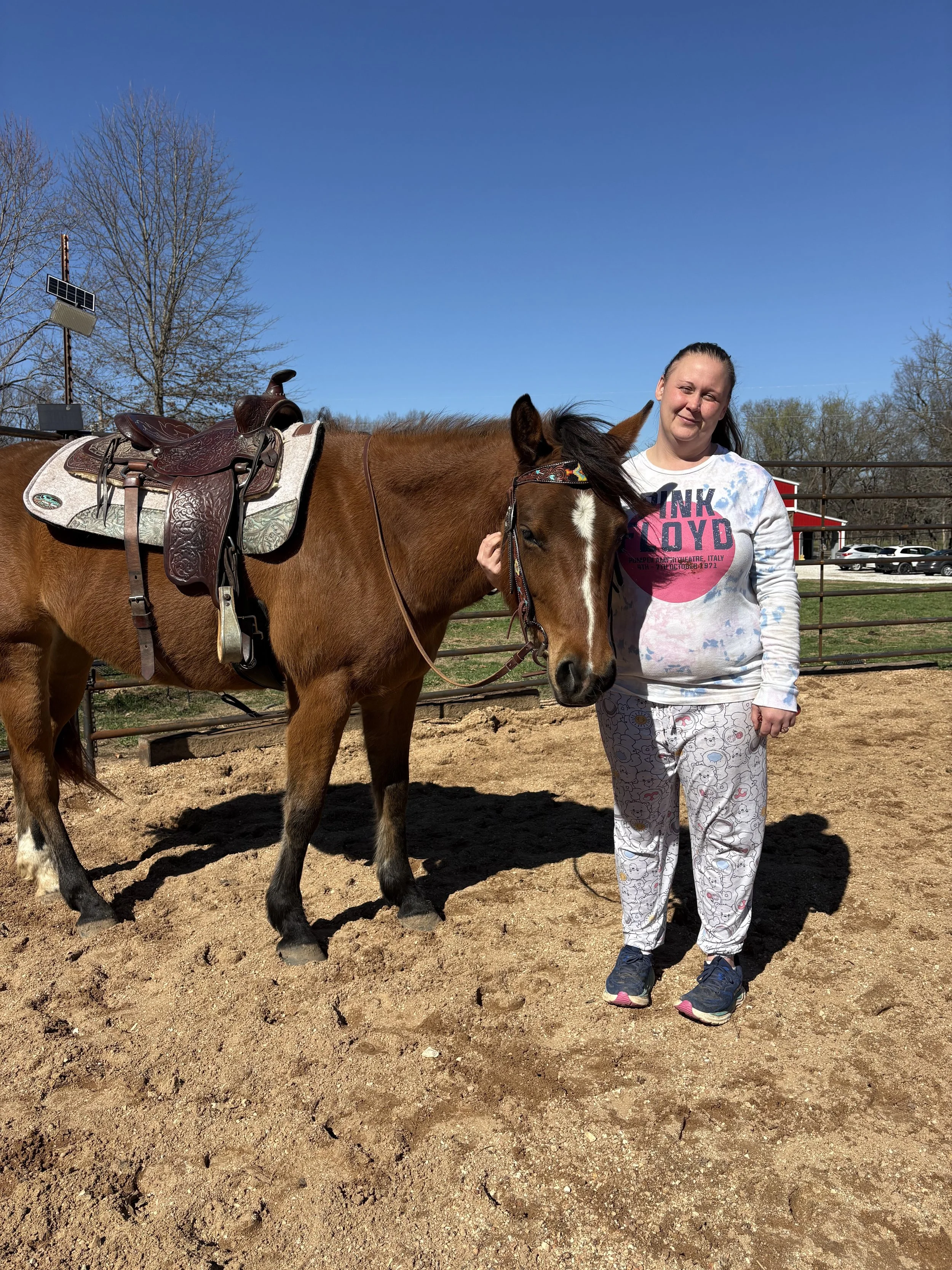 A bay Quarter Horse and her owner